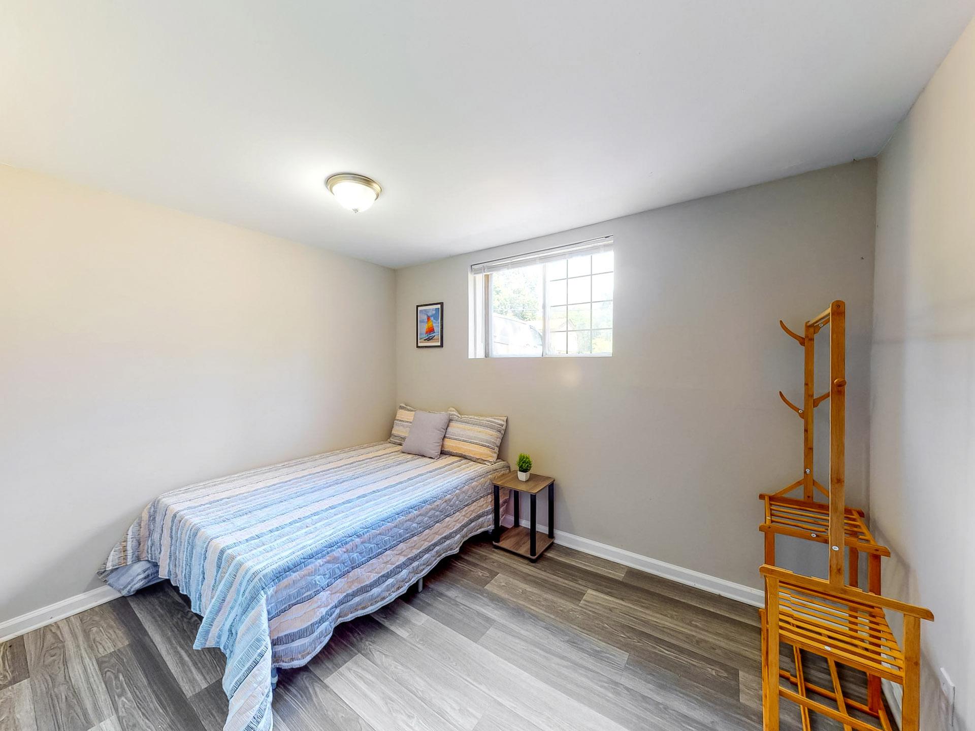 downstairs floor, full-bed, with street view window. Room size of 11'1"x8'6"