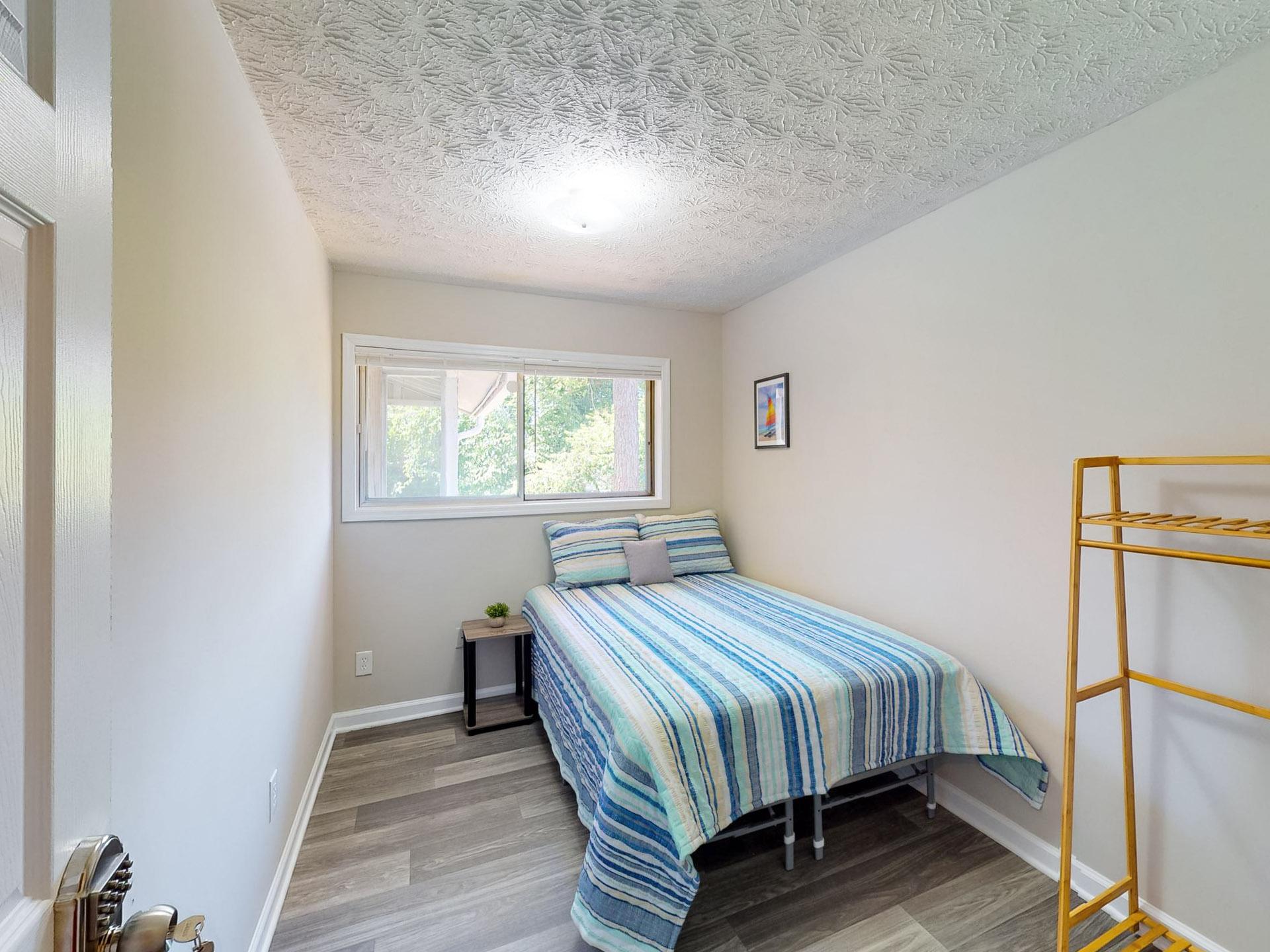 on the top floor, full-bed, with wall to wall backyard window. Cozy room size of 7'11"x10'11"