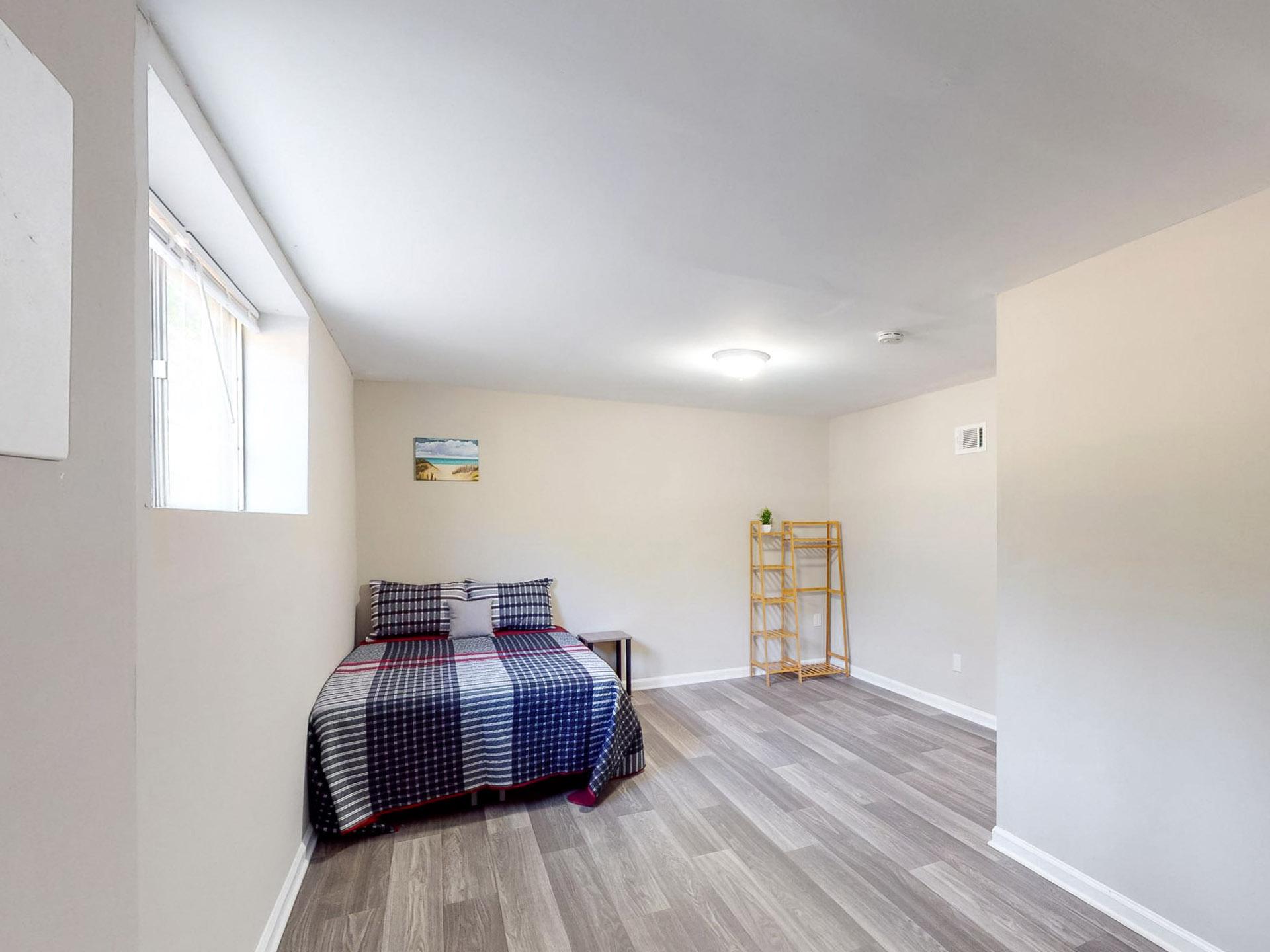 downstairs floor, full-bed, with wide street view window. The bathroom is across the hall. Largest room size of 19'0"x12'8"