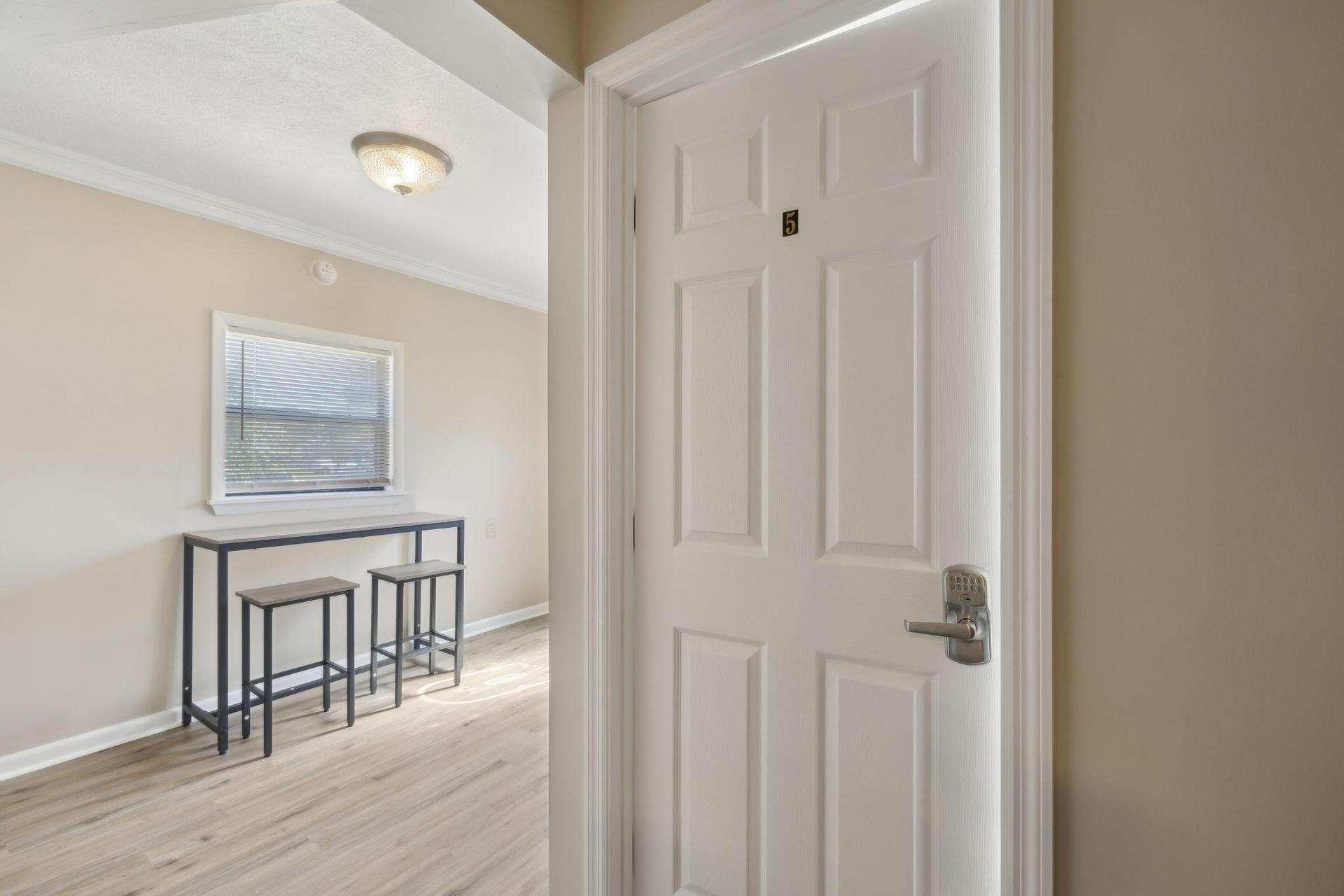 Bedroom 5 is right off the main hallway with easy access to the kitch