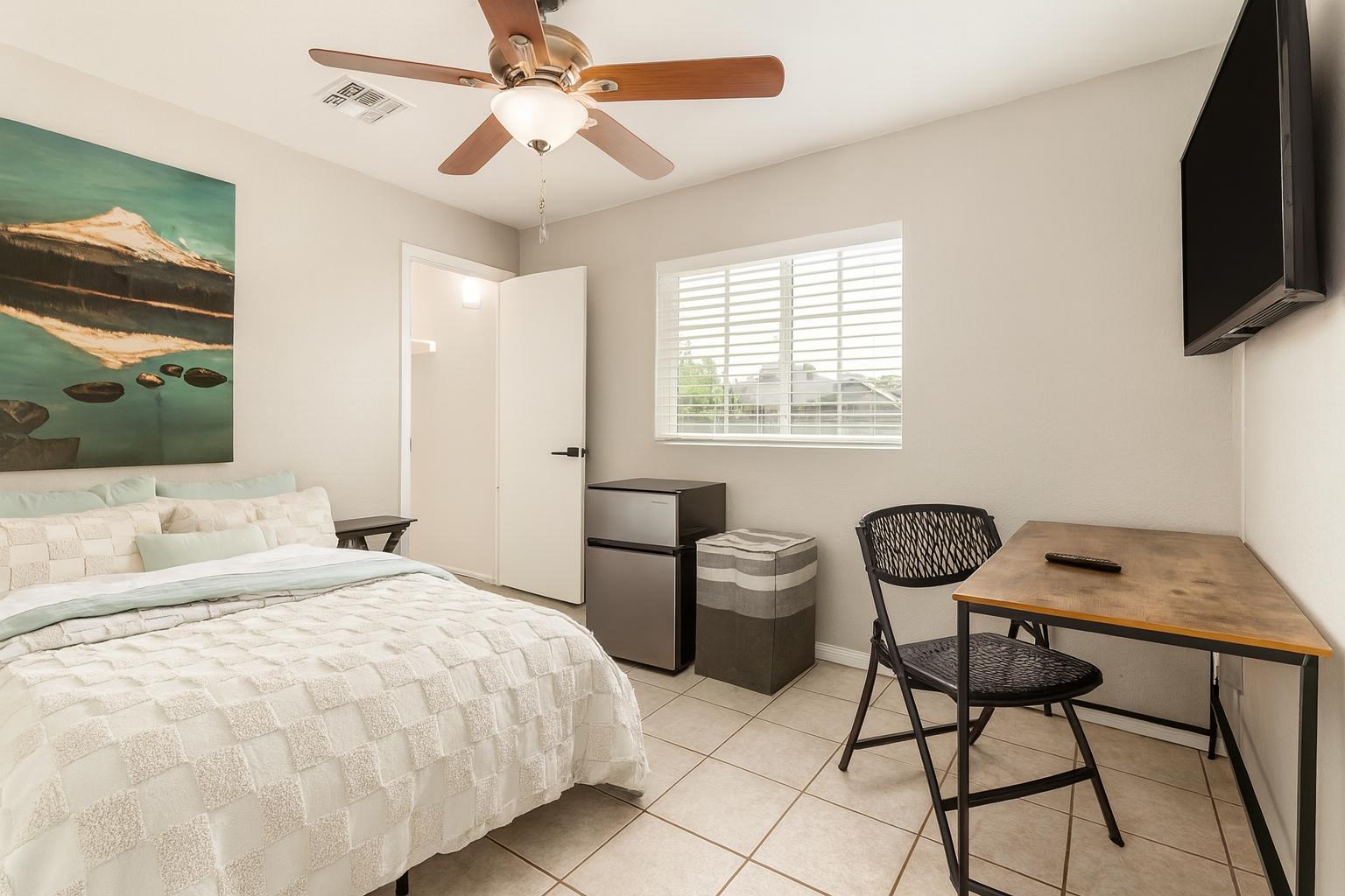 Bedroom 2- Features a Walk-In Closet, Designated Workspace,  Mini Fridge and Mounted TV!
