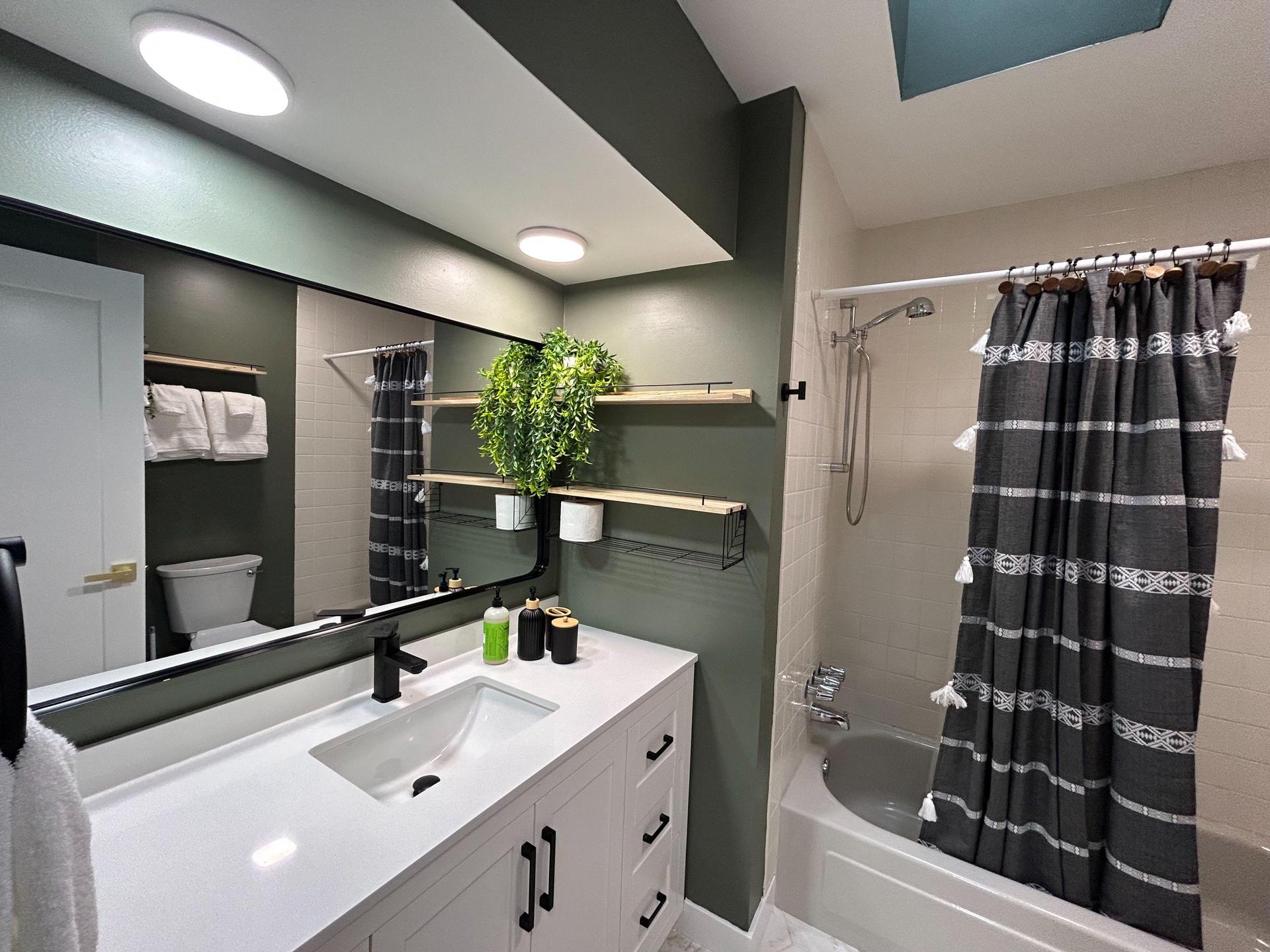 Right across the hall shared bath, with linen closets