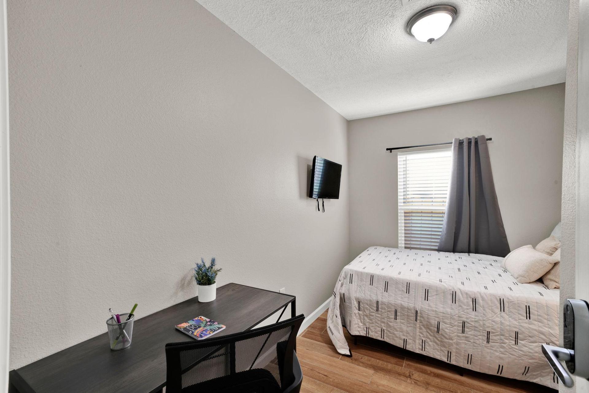 Premium room with workspace, blackout curtains, and TV all included