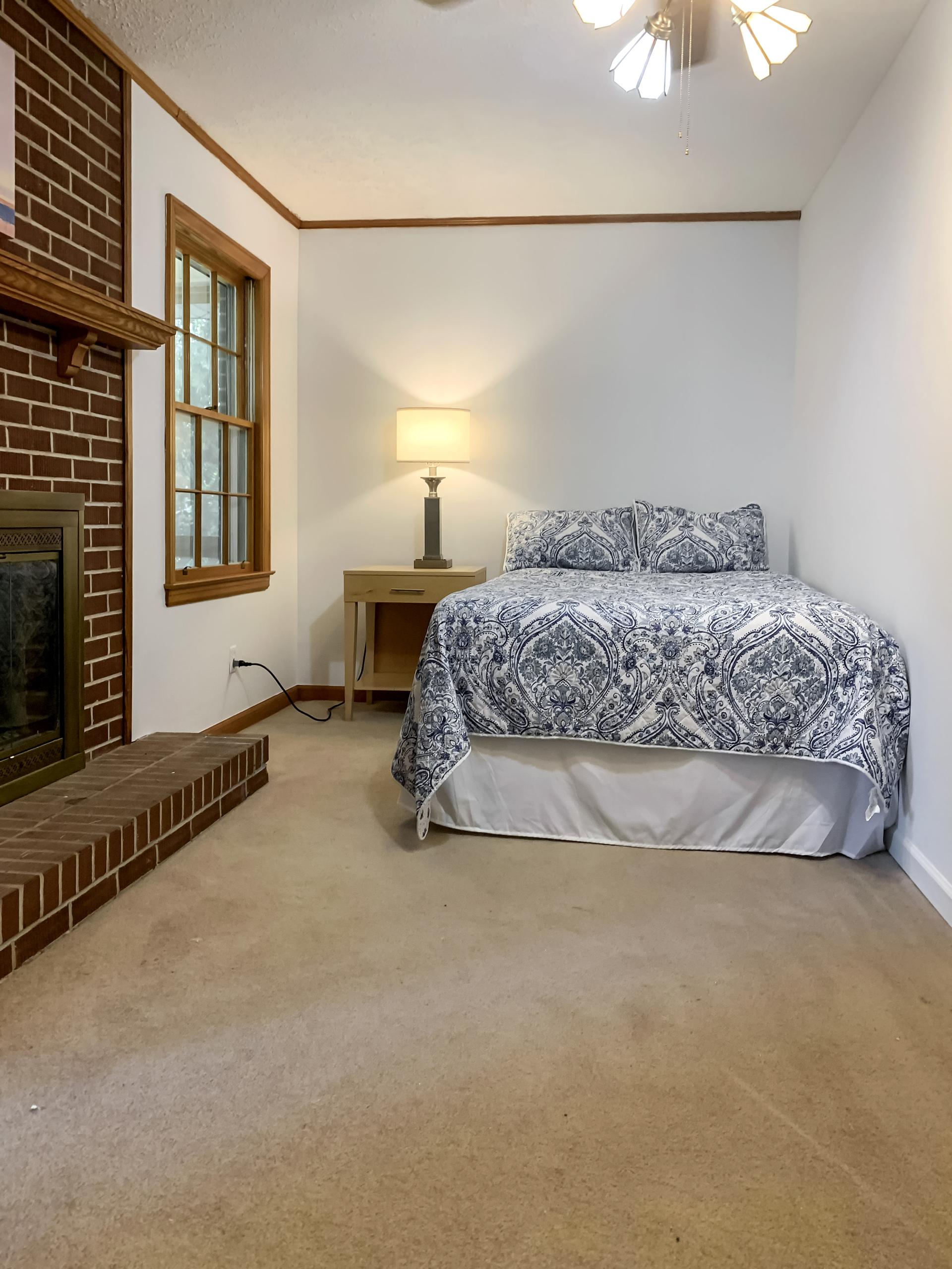 Full size bed with night stand and lamp