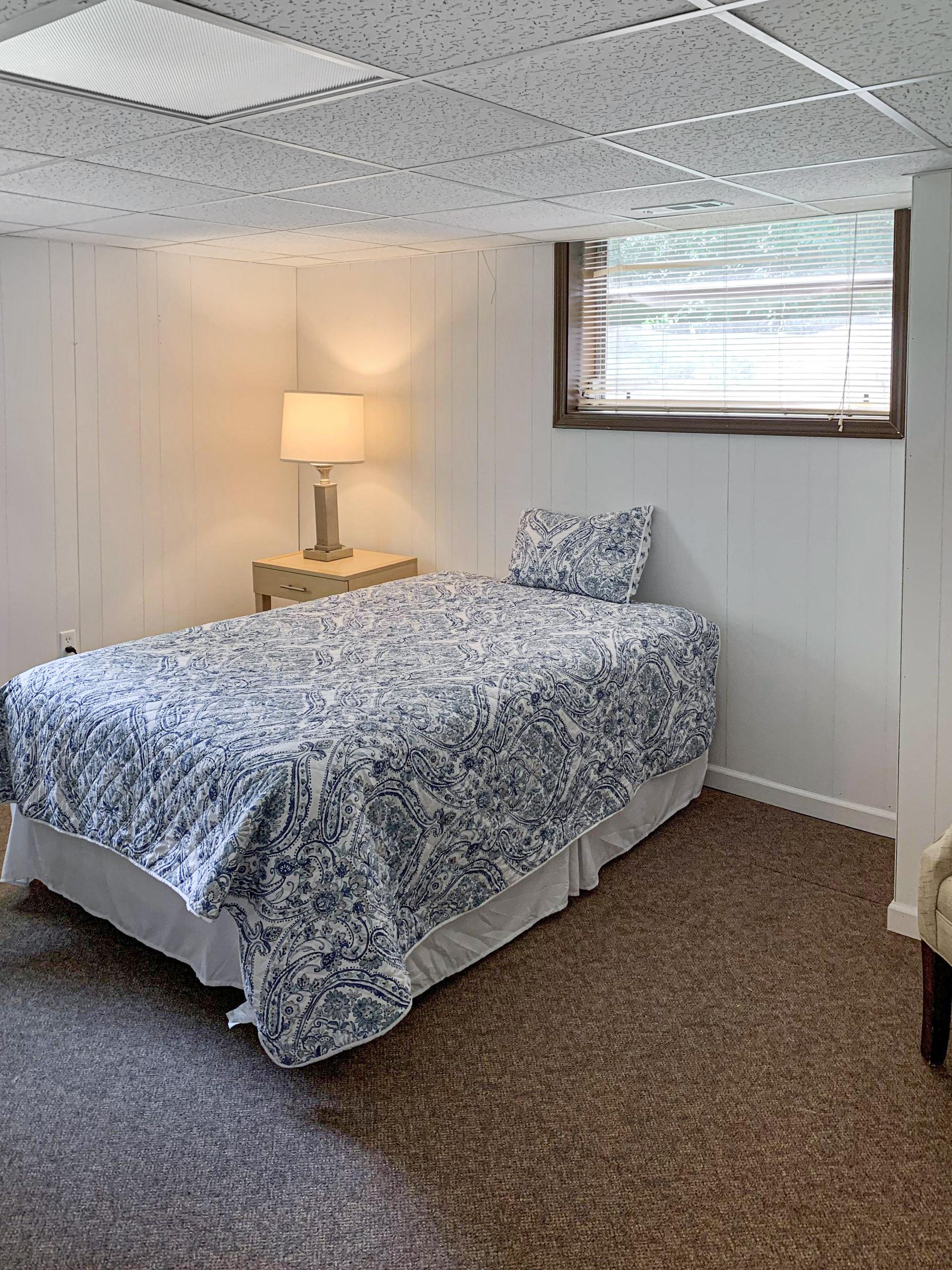 Terrace level (think cooler summers!) with nightstand, lamp, & seating