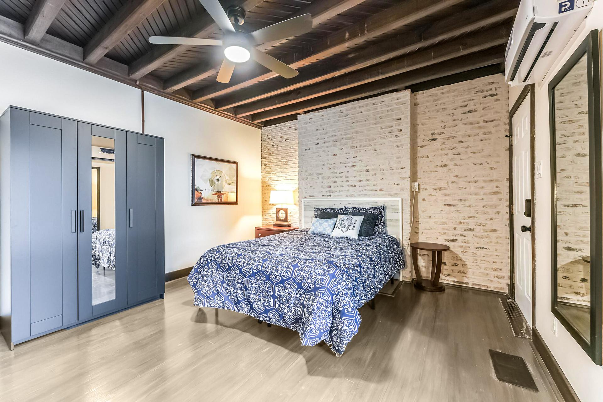 Beautiful brick accents the room and includes a separate entrance to the side of the house on driveway.