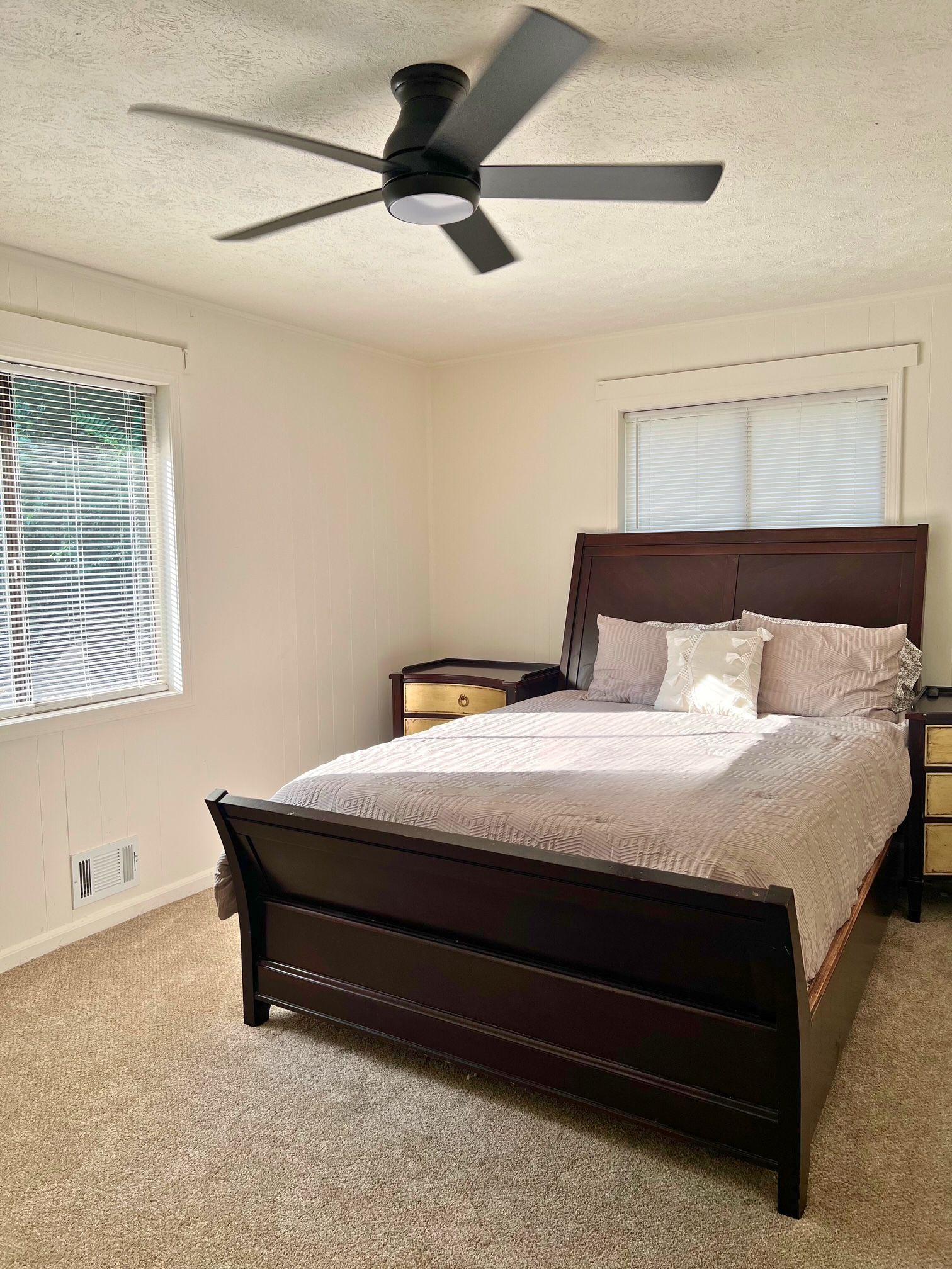 Room 1 Bed with nightstand and window view