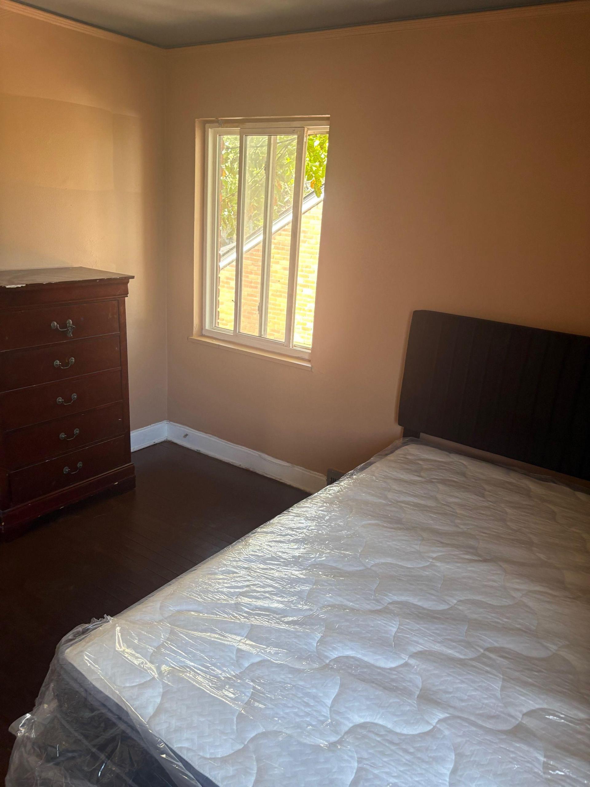 Each bedroom features a brand new queen bed, work desk, dresser, and a mini fridge—move-in ready for your comfort