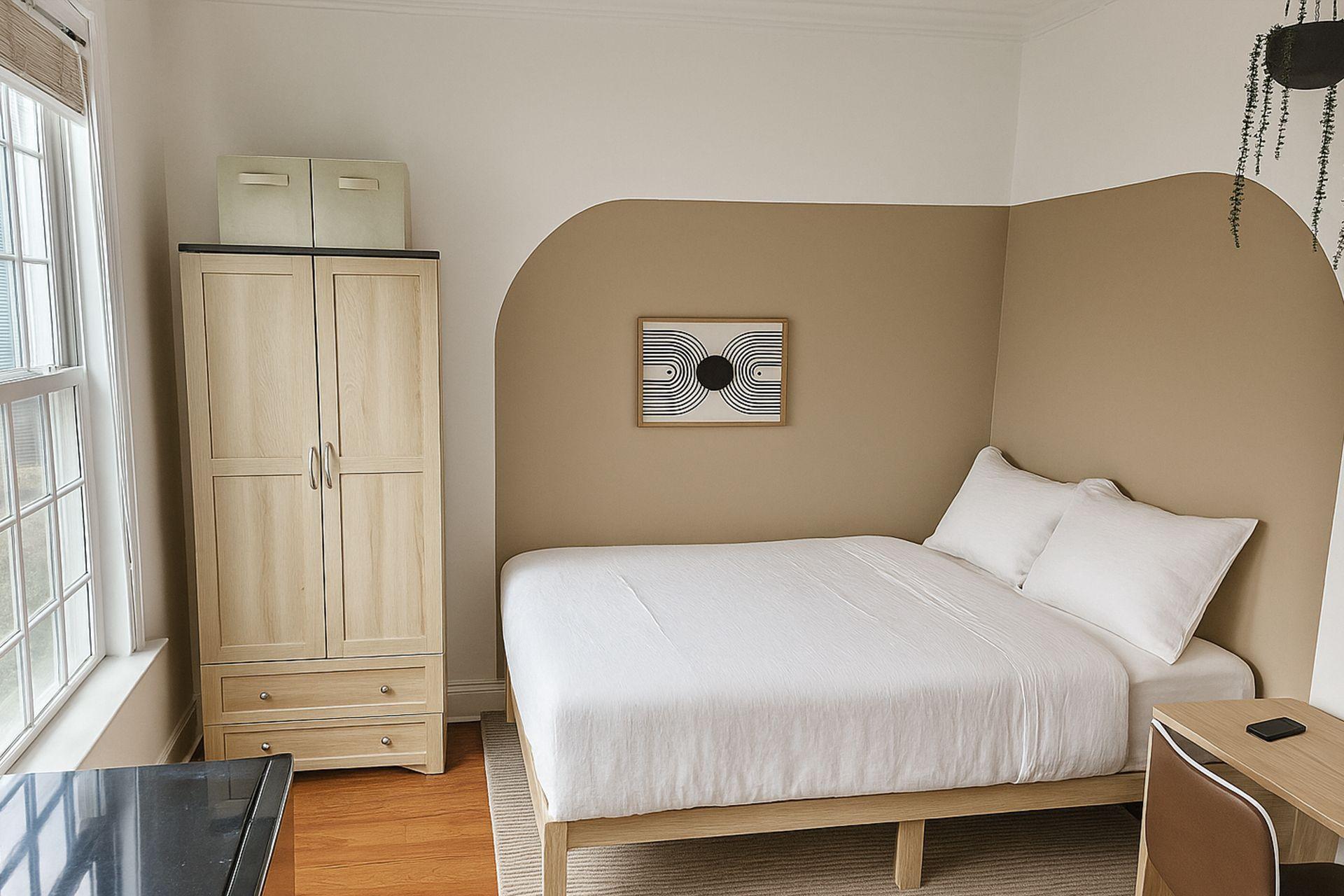 Room with a brand new smart TV, mini 2-door fridge, electric standing desk,  and whisper-quiet fan.