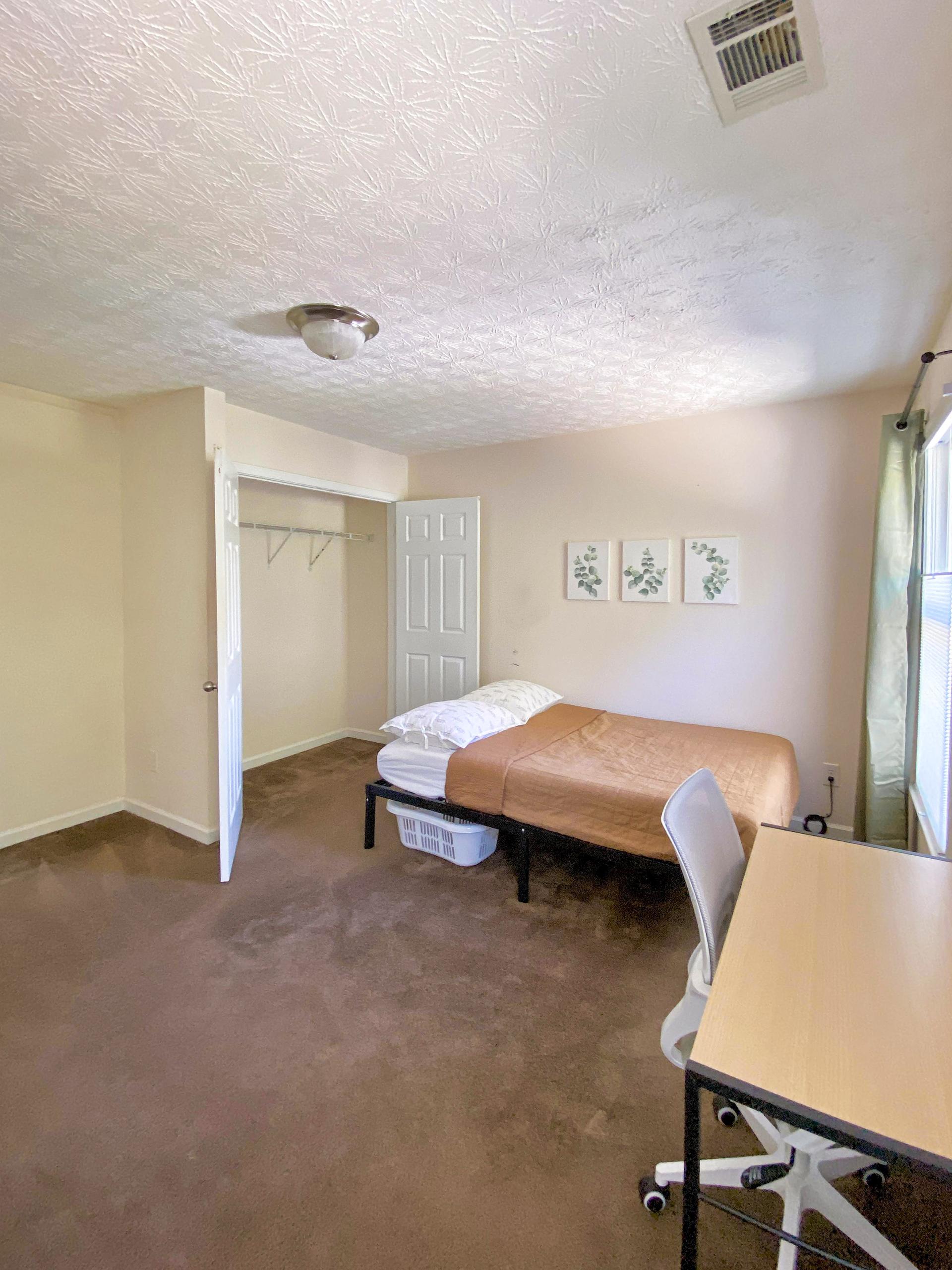 Double doors closet and under bed storage space