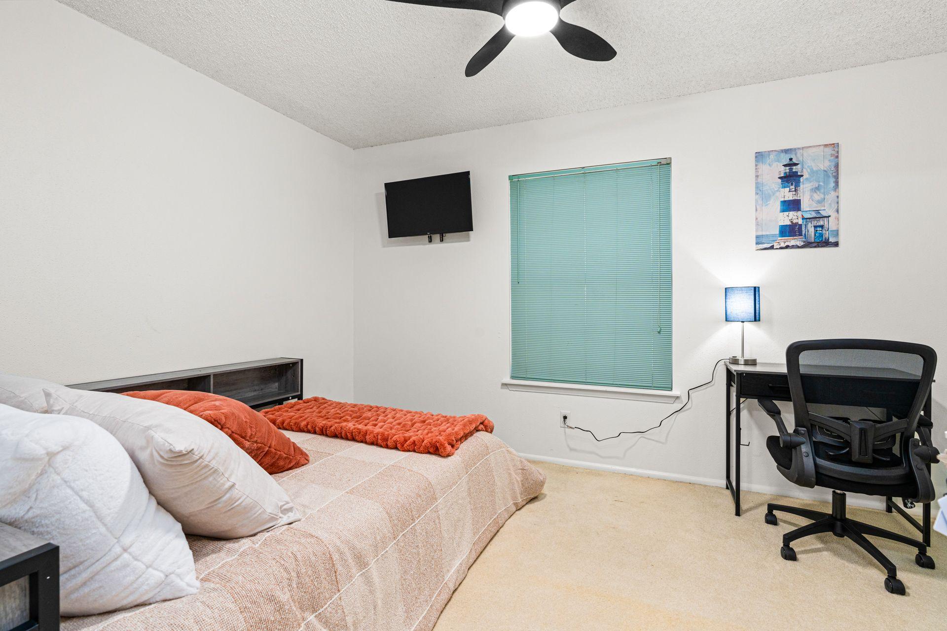 Full size bed with extra storage, charging ports, and TV!