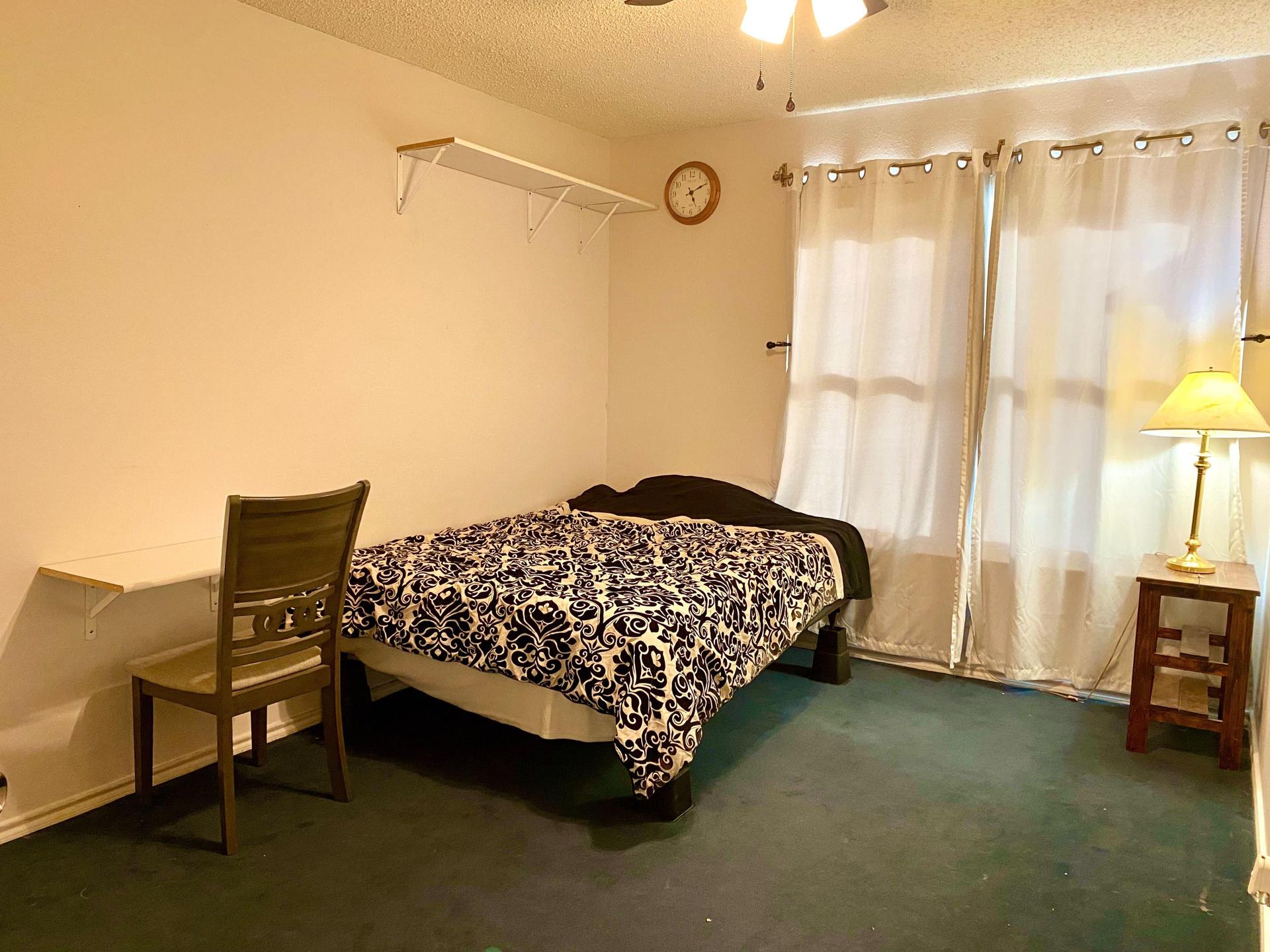 Bedroom 2 with bed and side table