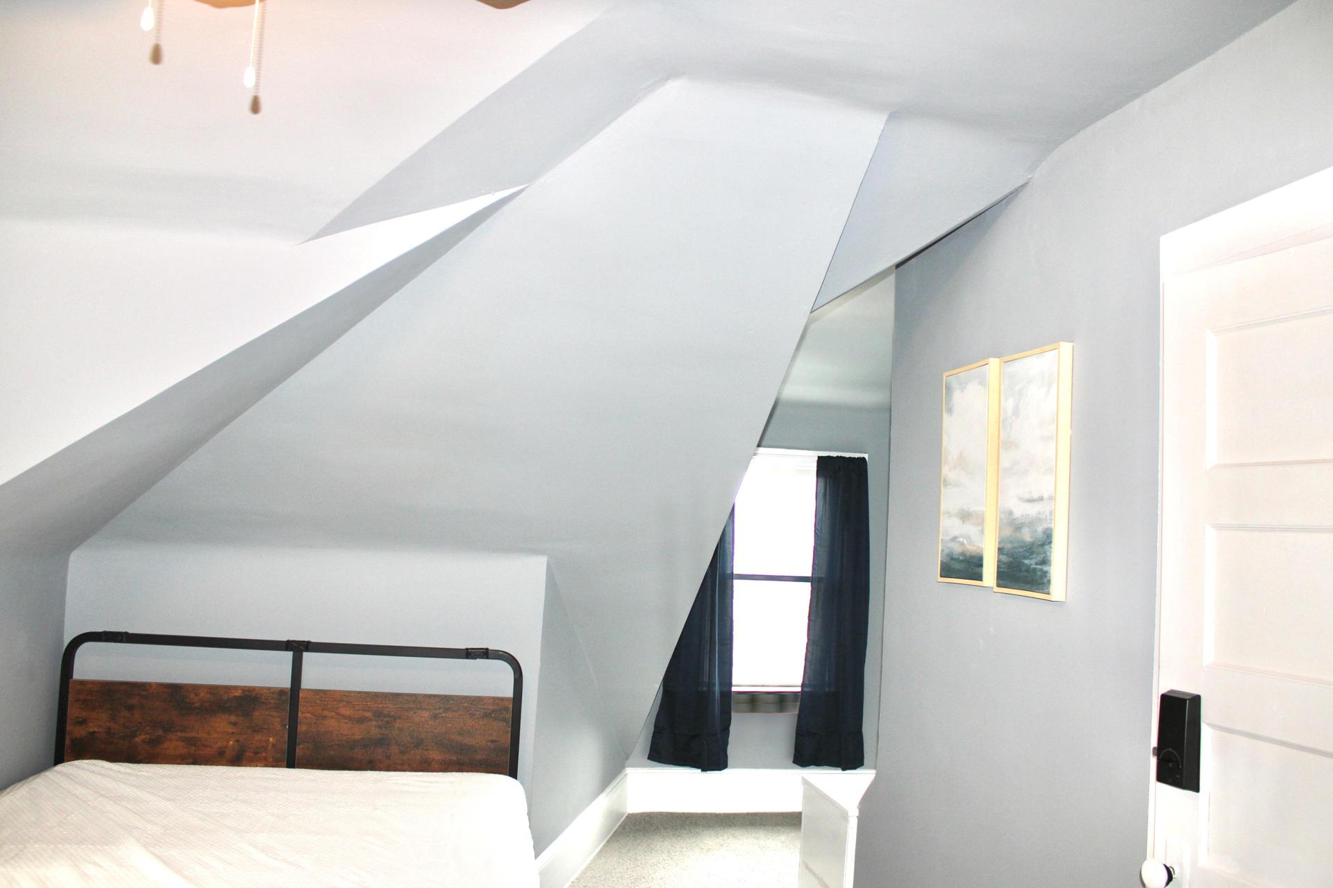 Mini studio apartment with full private bathroom, small kitchen, and living space, as well as separate bedroom.