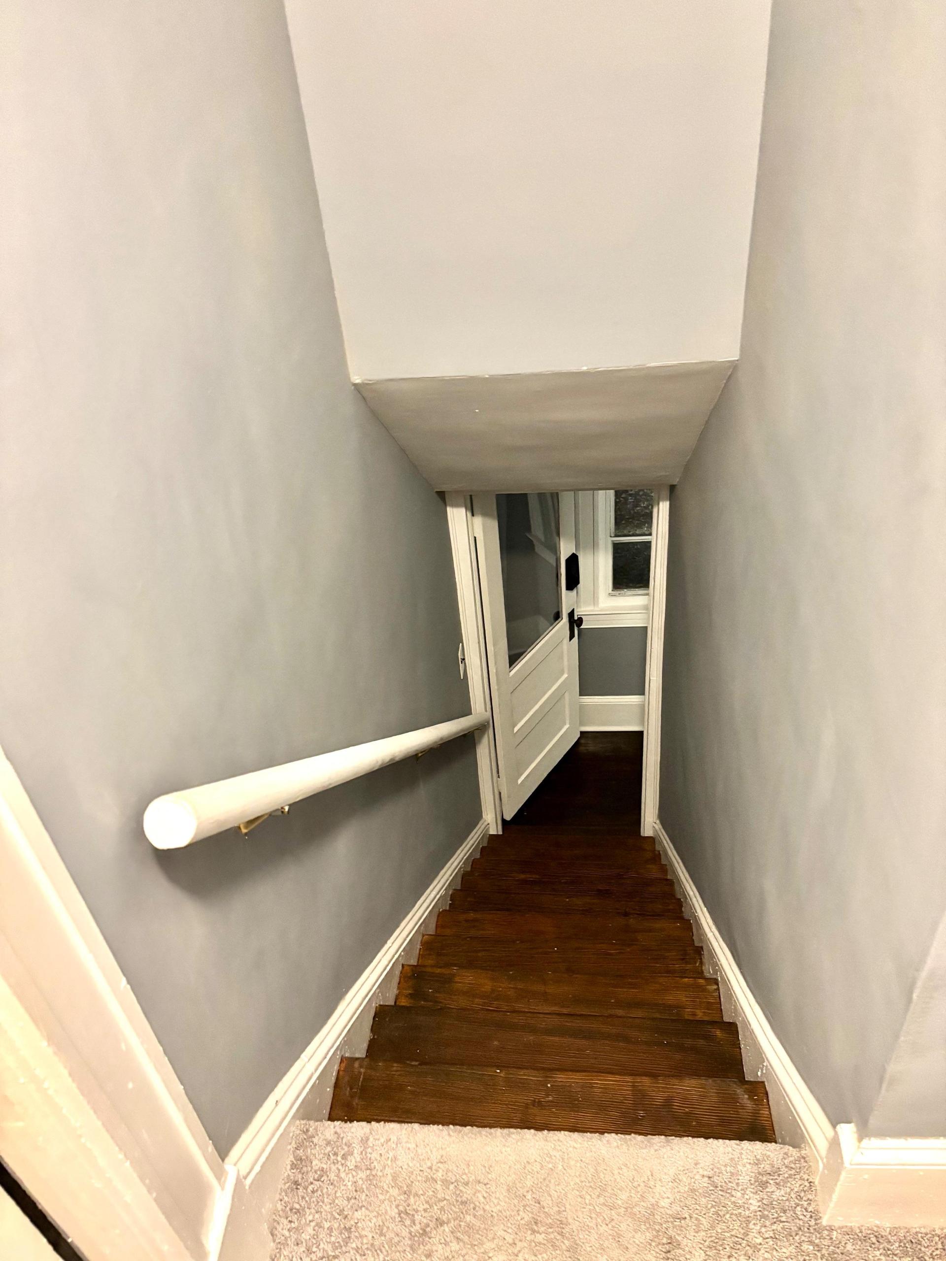 Mini studio apartment with full private bathroom, small kitchen, and living space, as well as separate bedroom.