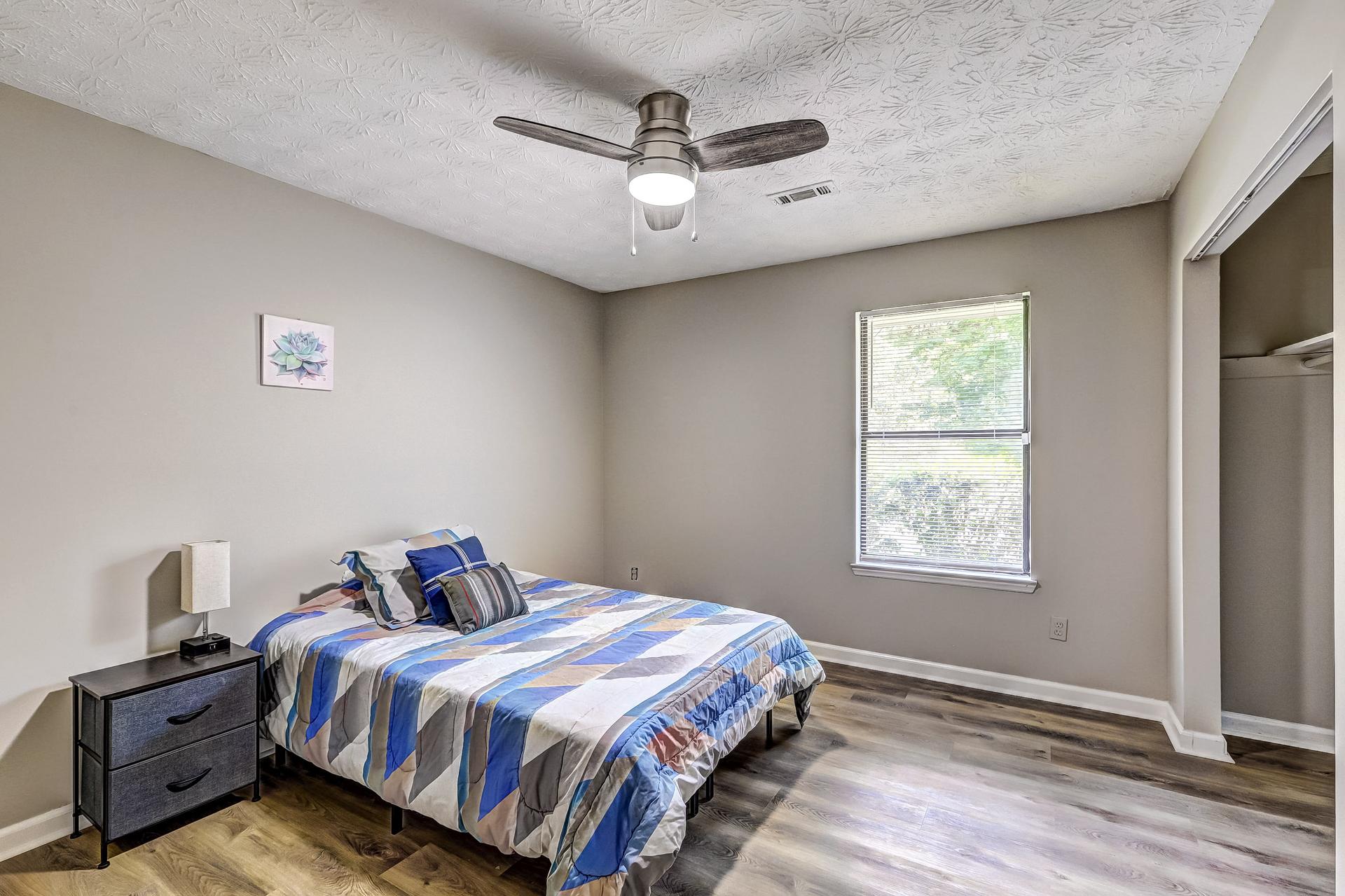 bedroom, detected: ceiling fan, bed, window blind