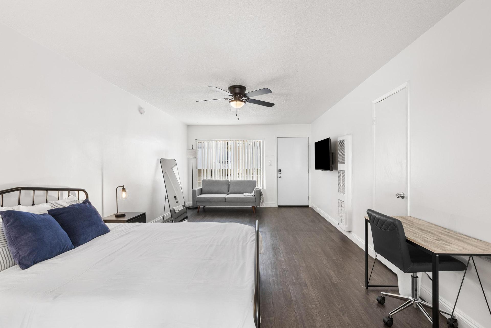 Queen bed with mattress protector.