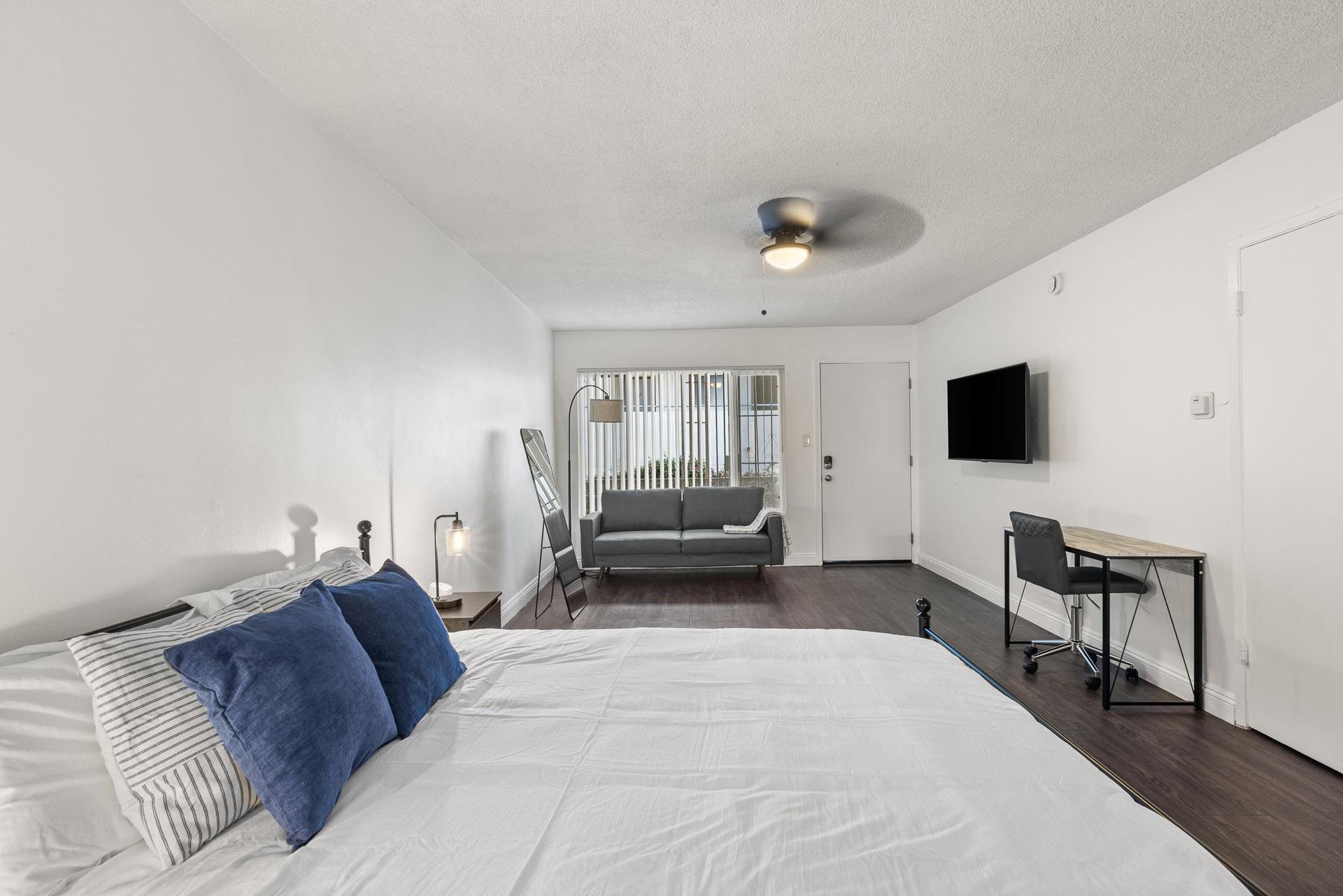 Queen bed with mattress protector.