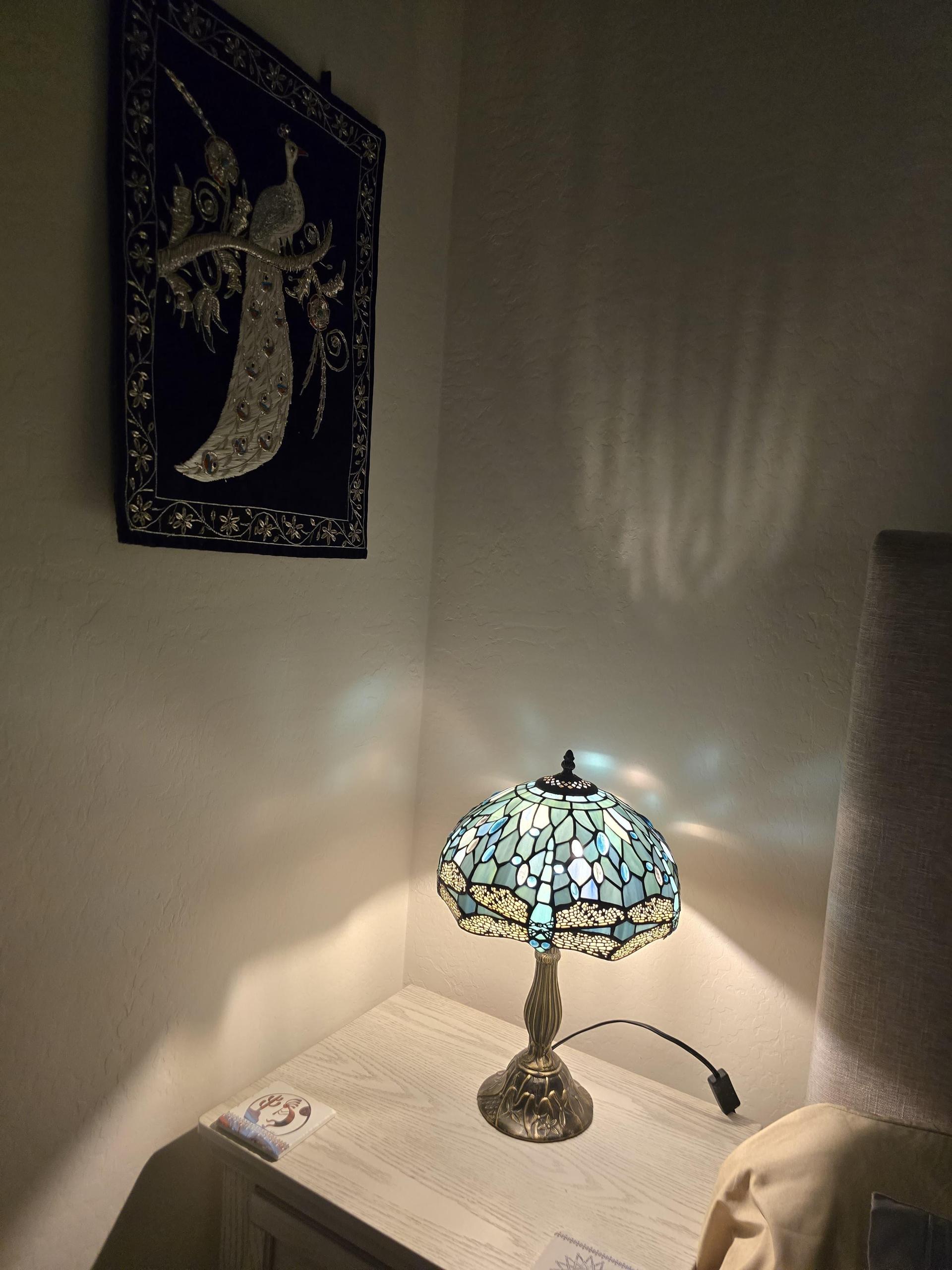 Nightstand with glass lamp, coasters, and charging ports USB, USB-C, and standard—ready for all your bedside devices.