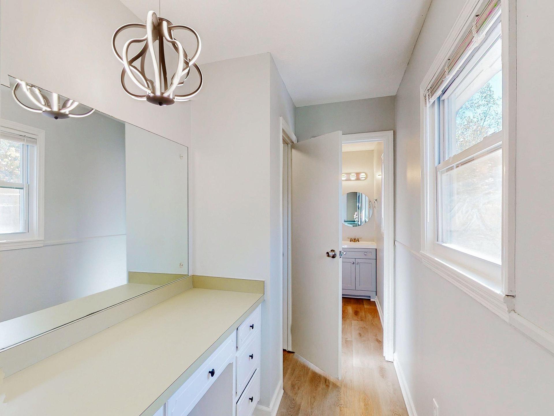 Separate dressing area with additional vanity and mirror area