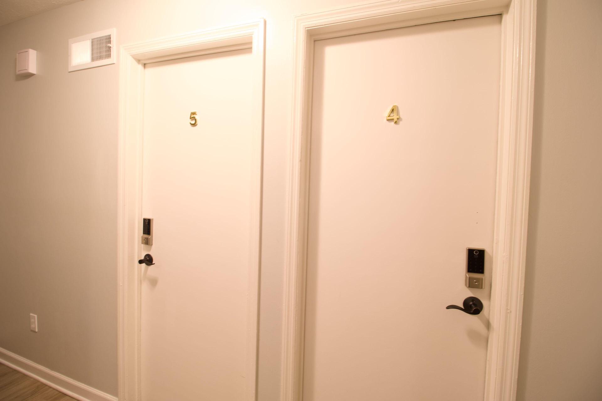 Door to Room 4 - Cozy room with full bed, reach in closet, height adjustable desk and desk chair and ceiling fan