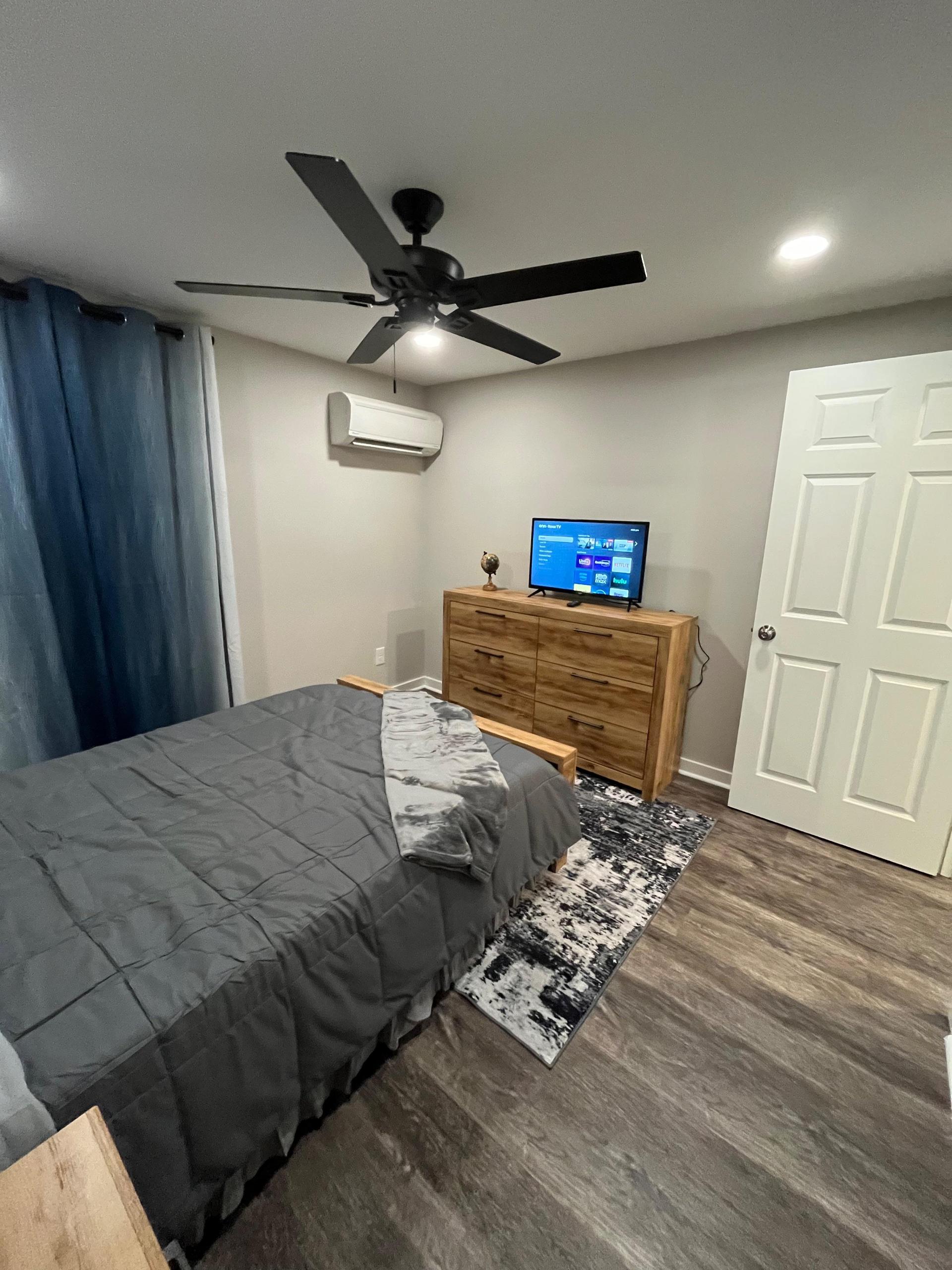 TV included. Rugs, decor, artwork, and bedding not included.