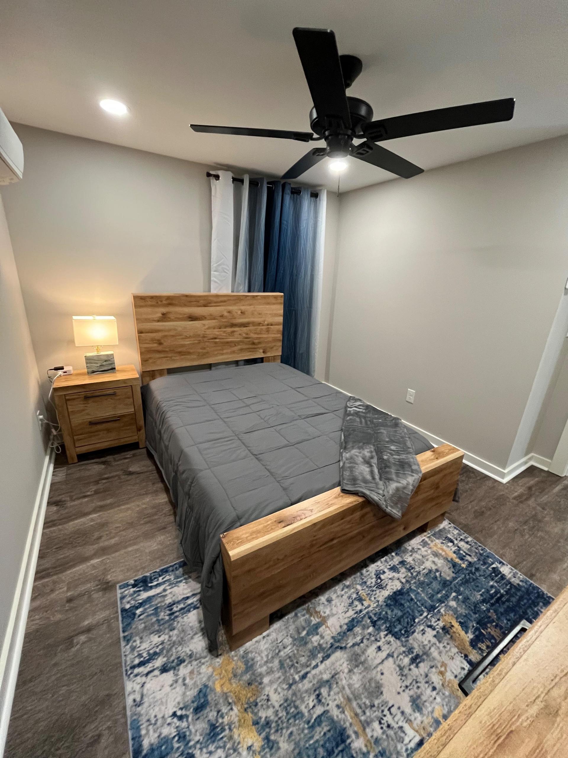 TV included. Rugs, decor, artwork, and bedding not included.