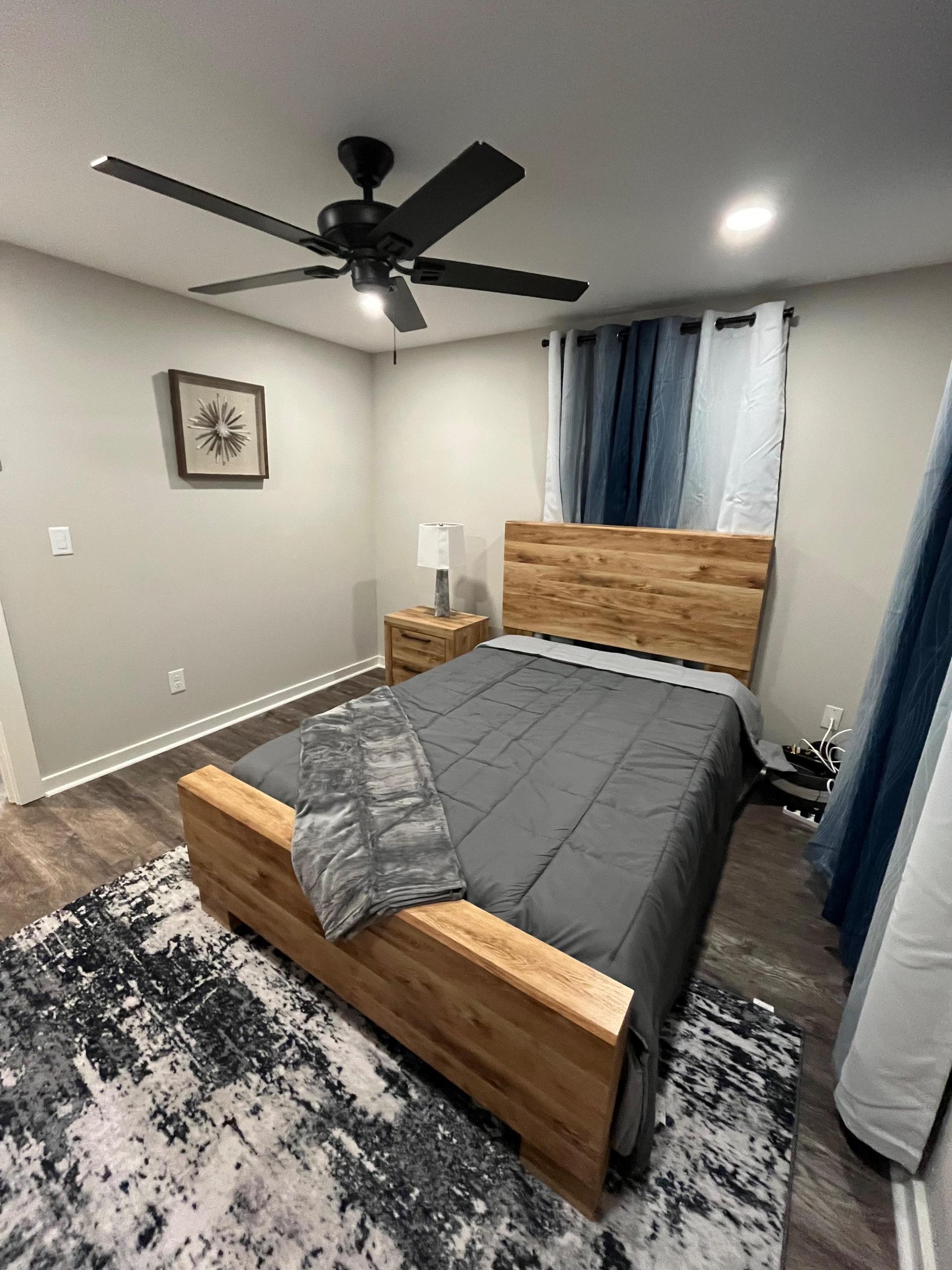 TV included. Rugs, decor, artwork, and bedding not included.