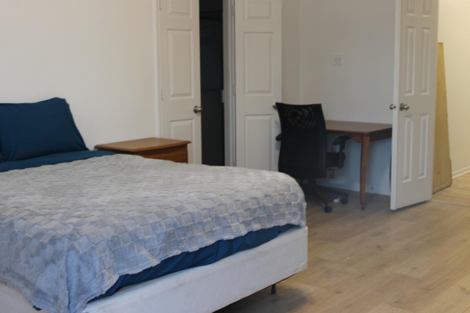 Queen Bed with Desk, Dresser, Closet, Lamp, and Mini-Fridge