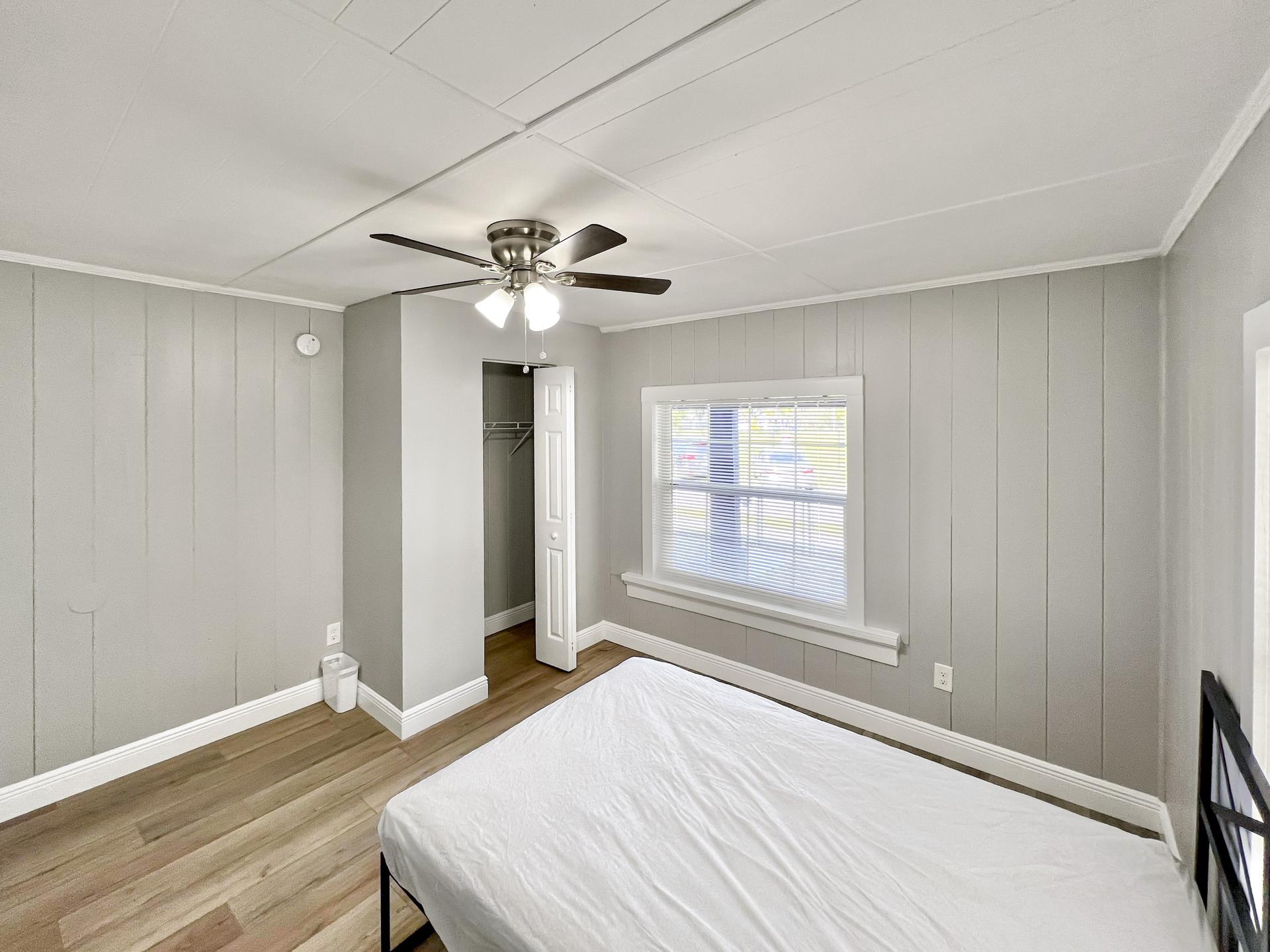 bedroom, detected: ceiling fan, bed, window blind