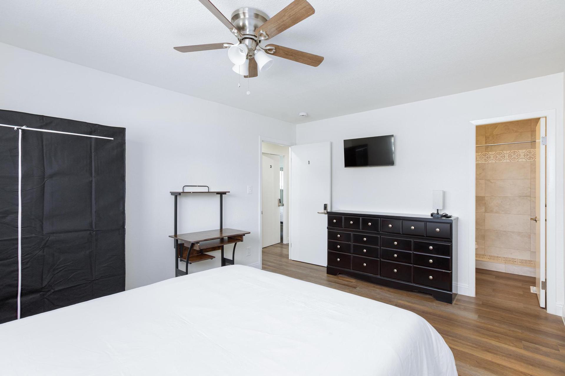 Room 1 with a Dresser, TV and private bathroom