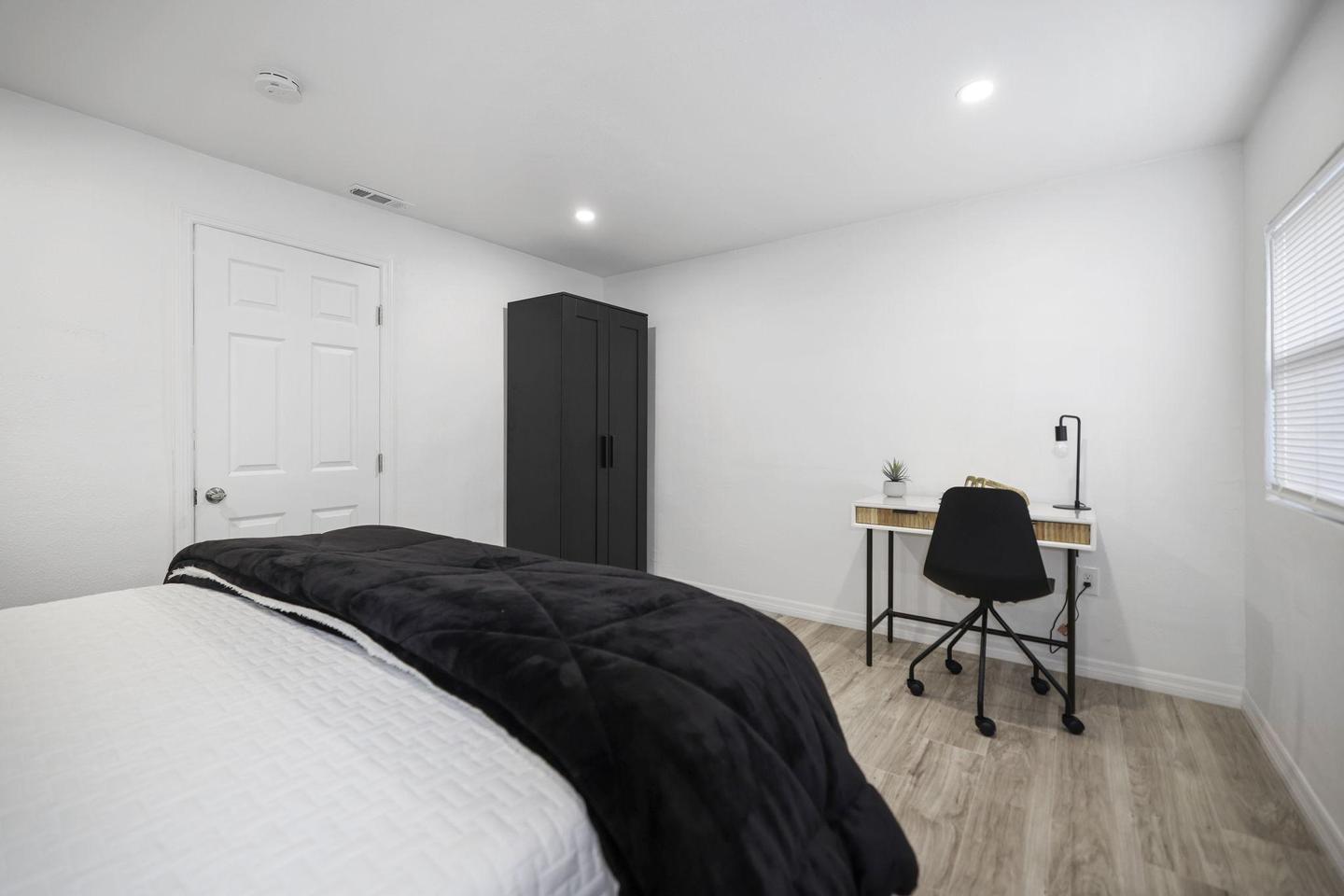 Bedroom 2 Angle 2 (Bed, Armoire & Desk View)