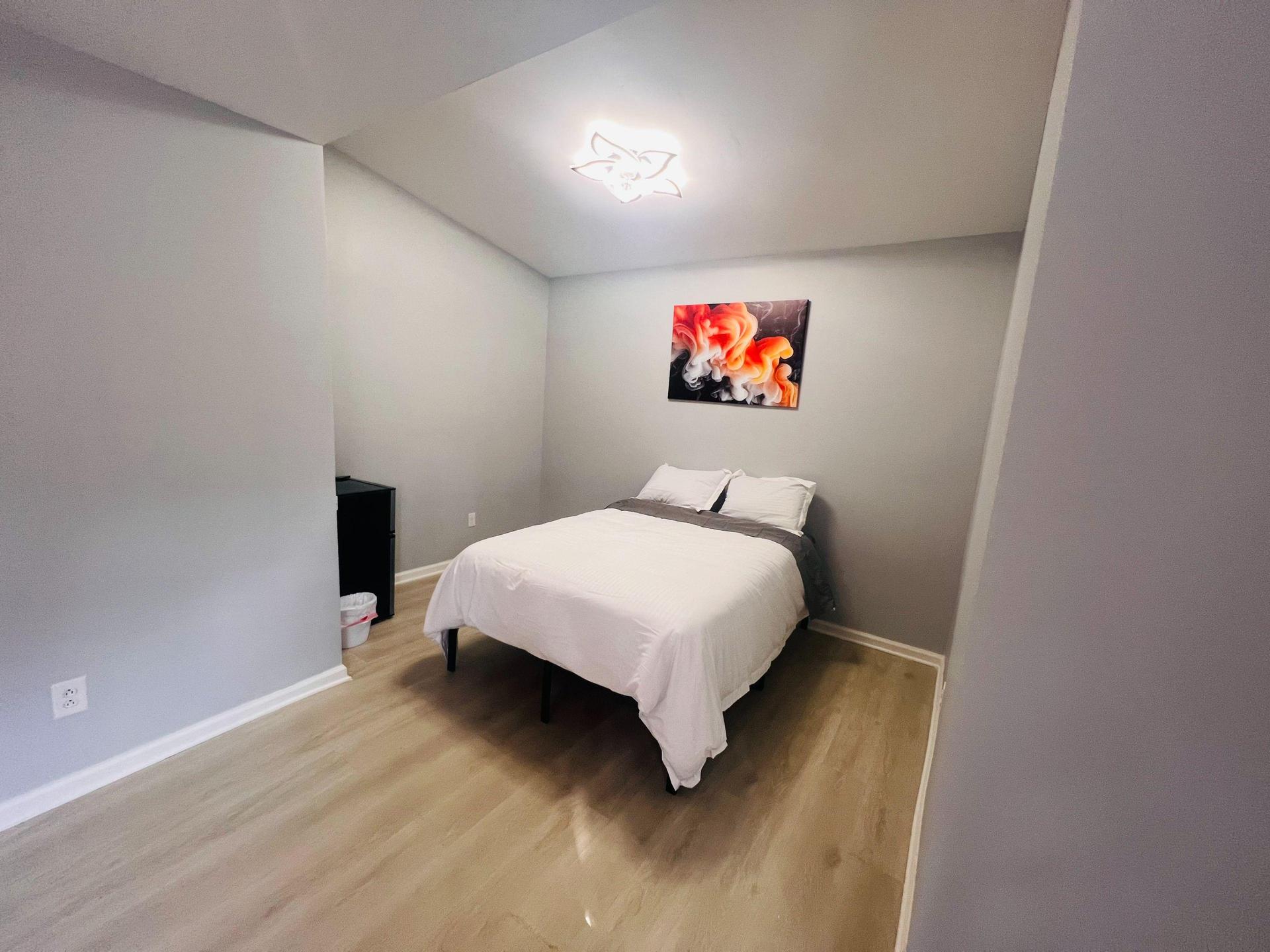 Full Bed Showing Fridge