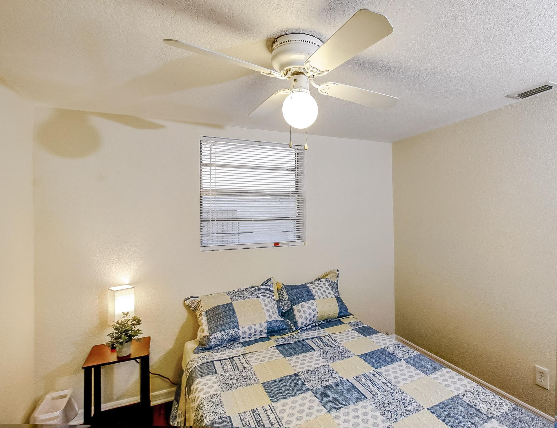 bedroom, detected: window blind, ceiling fan, bed