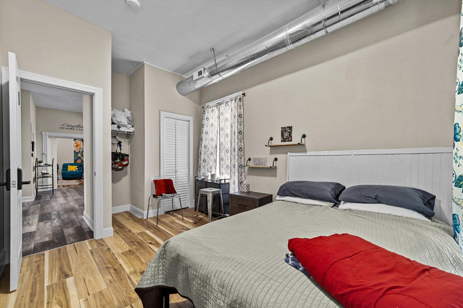 Bedroom 1 is located on the main floor, next to the kitchen and full bathroom.