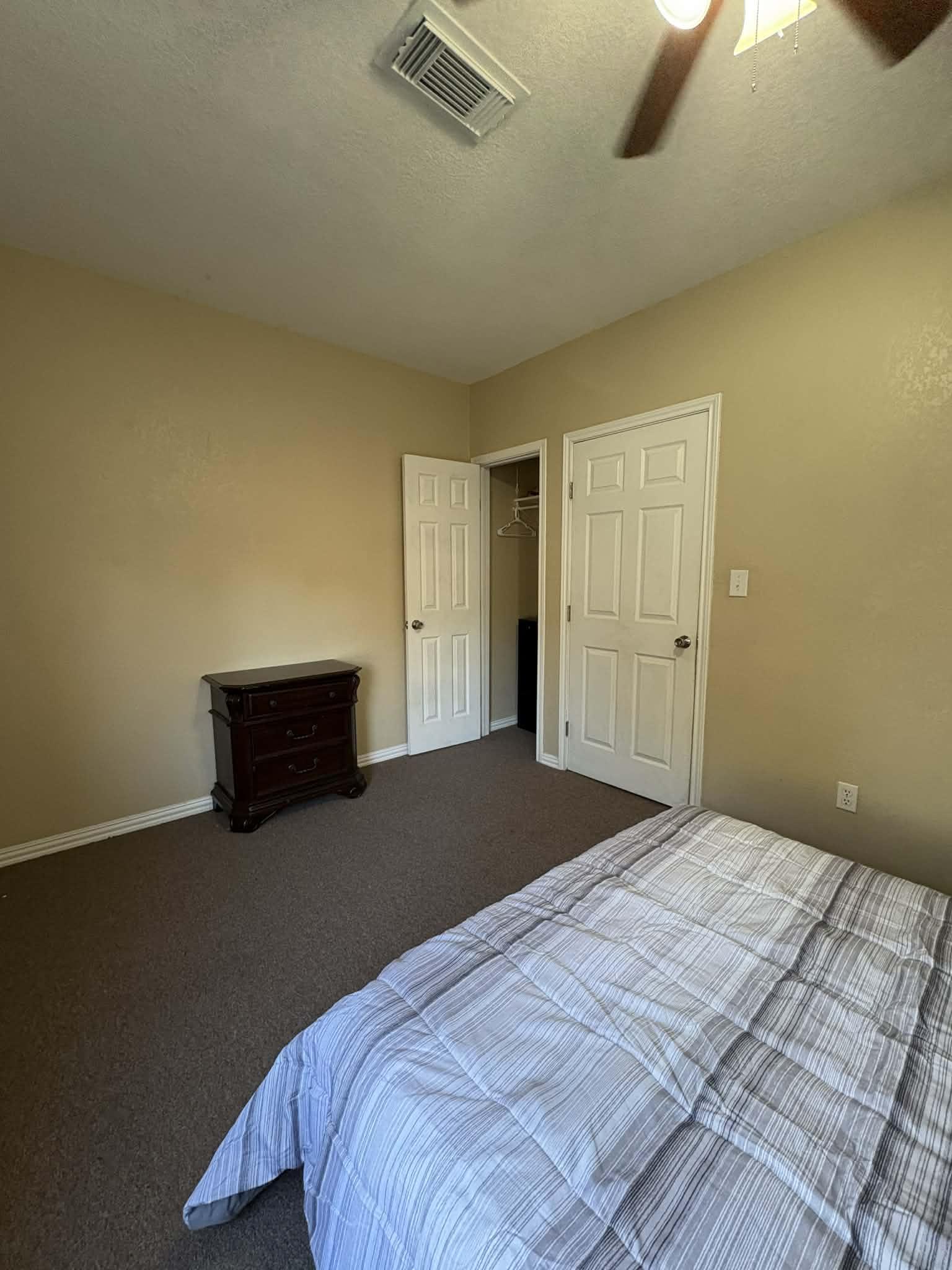 Small dresser in addition to a reach in closet.