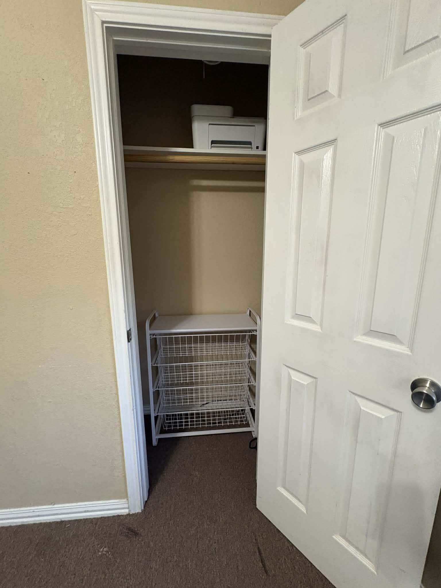 Closet has wire drawers in the closet for additional closing or storage.