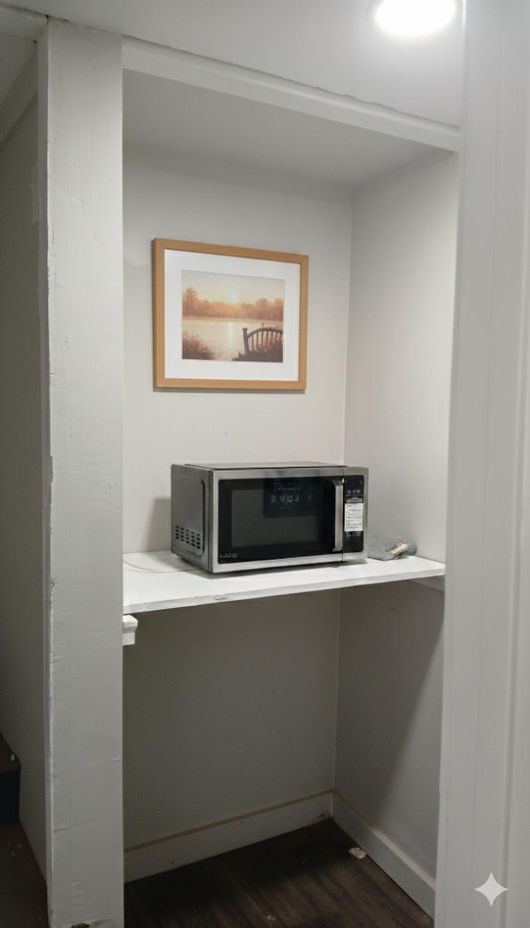 Private kitchenette area with microwave