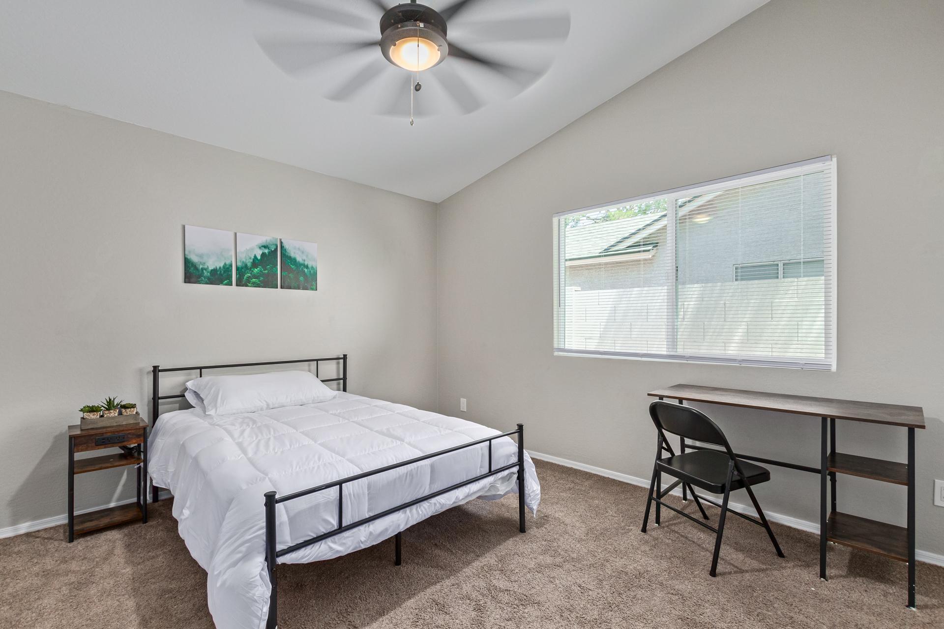 Vaulted ceiling  and private desk.