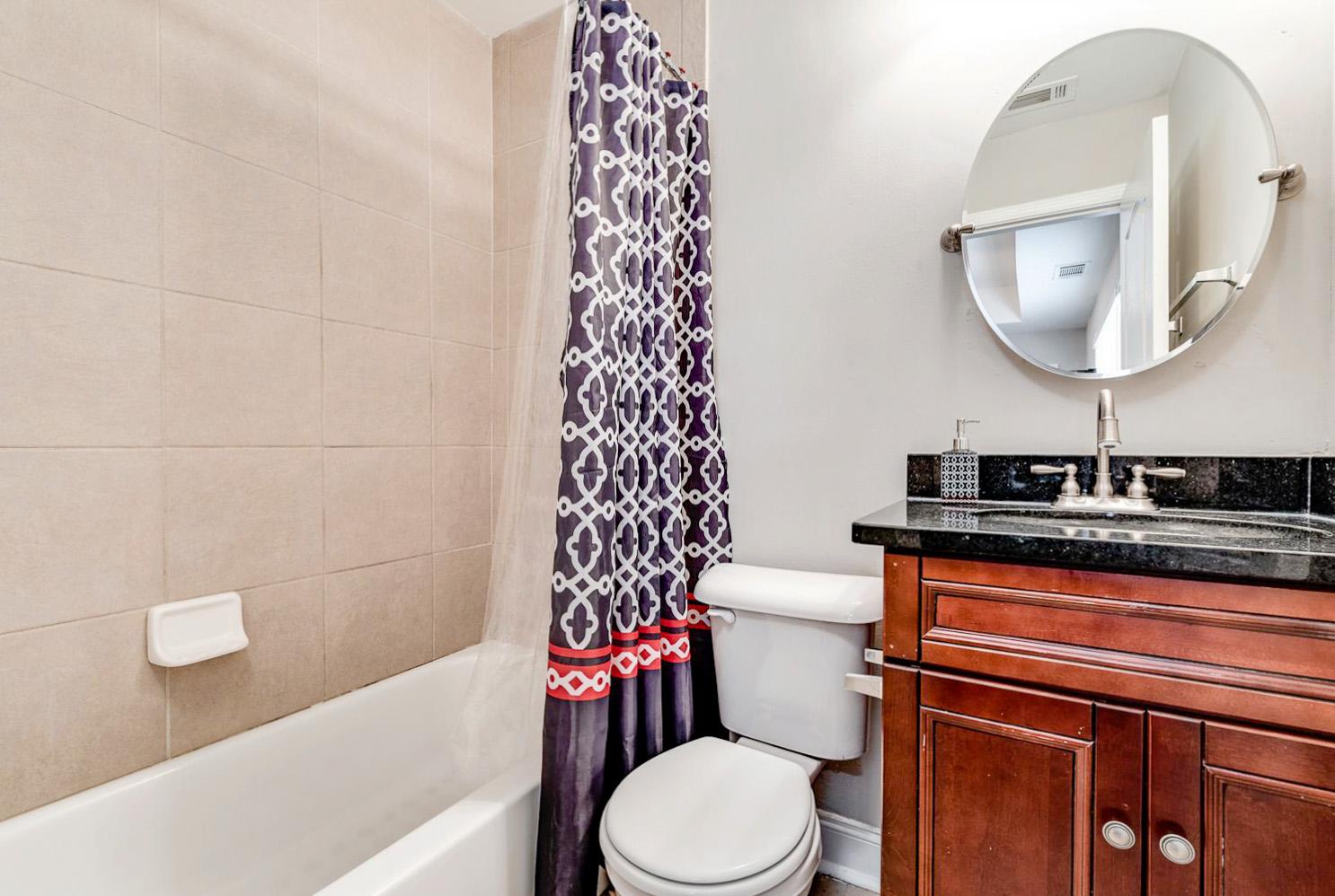 Private bathroom with shower/tub combo.