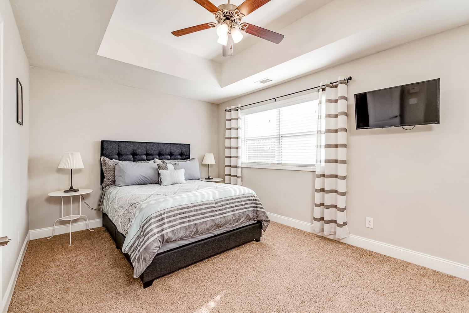 HUGE master suite! Queen bed w/ pillow top mattress + flat screen smart tv. Garage parking included.**Bedding not included.**