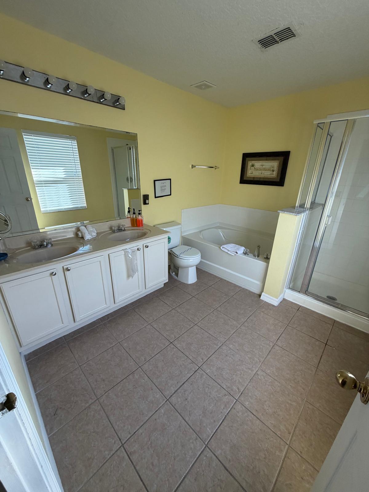 bathroom with tub and shower