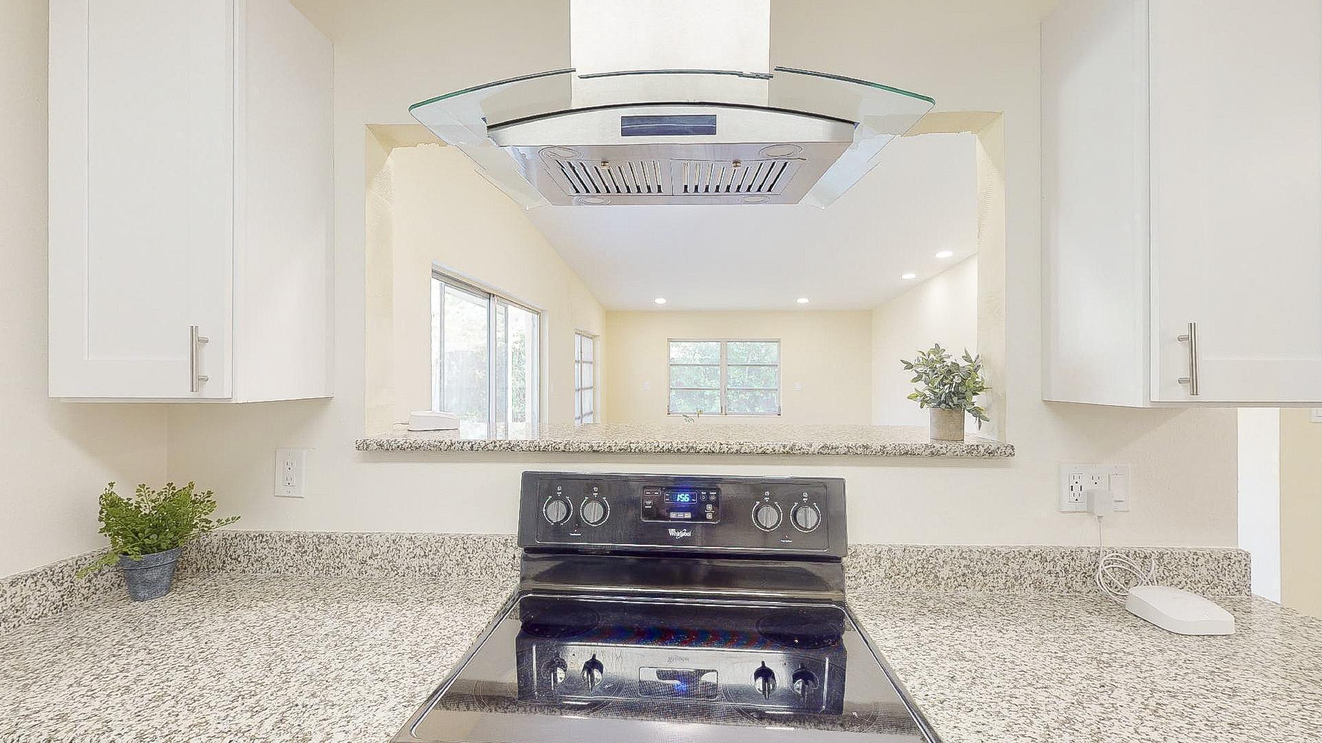Stove looking to dining area.