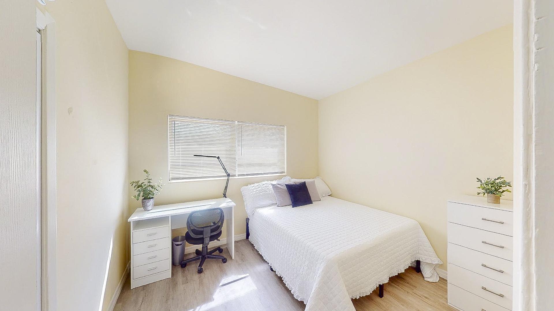 This room has a dresser and closet as well.