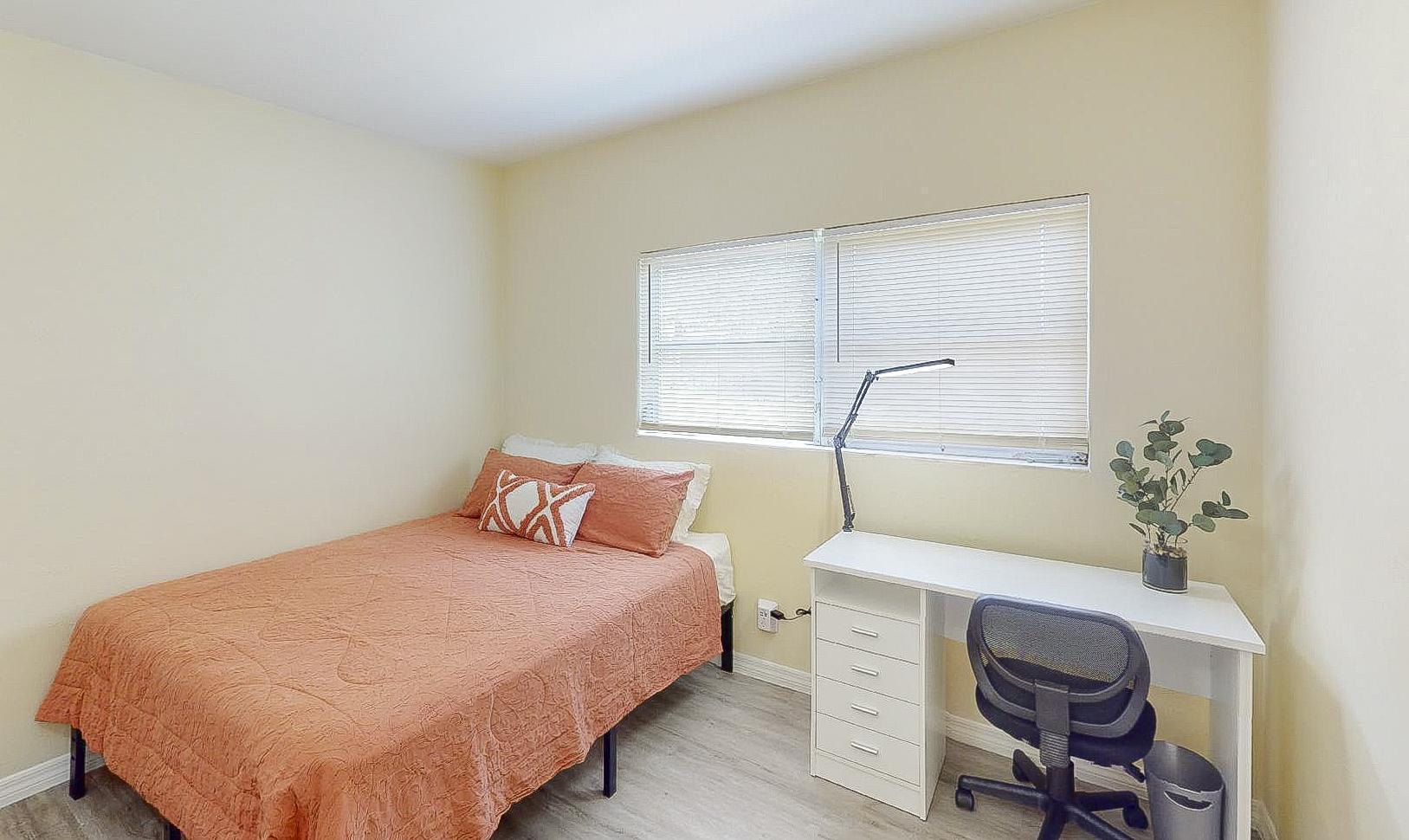 The dresser is at the foot of the bed. There is a closet as well
