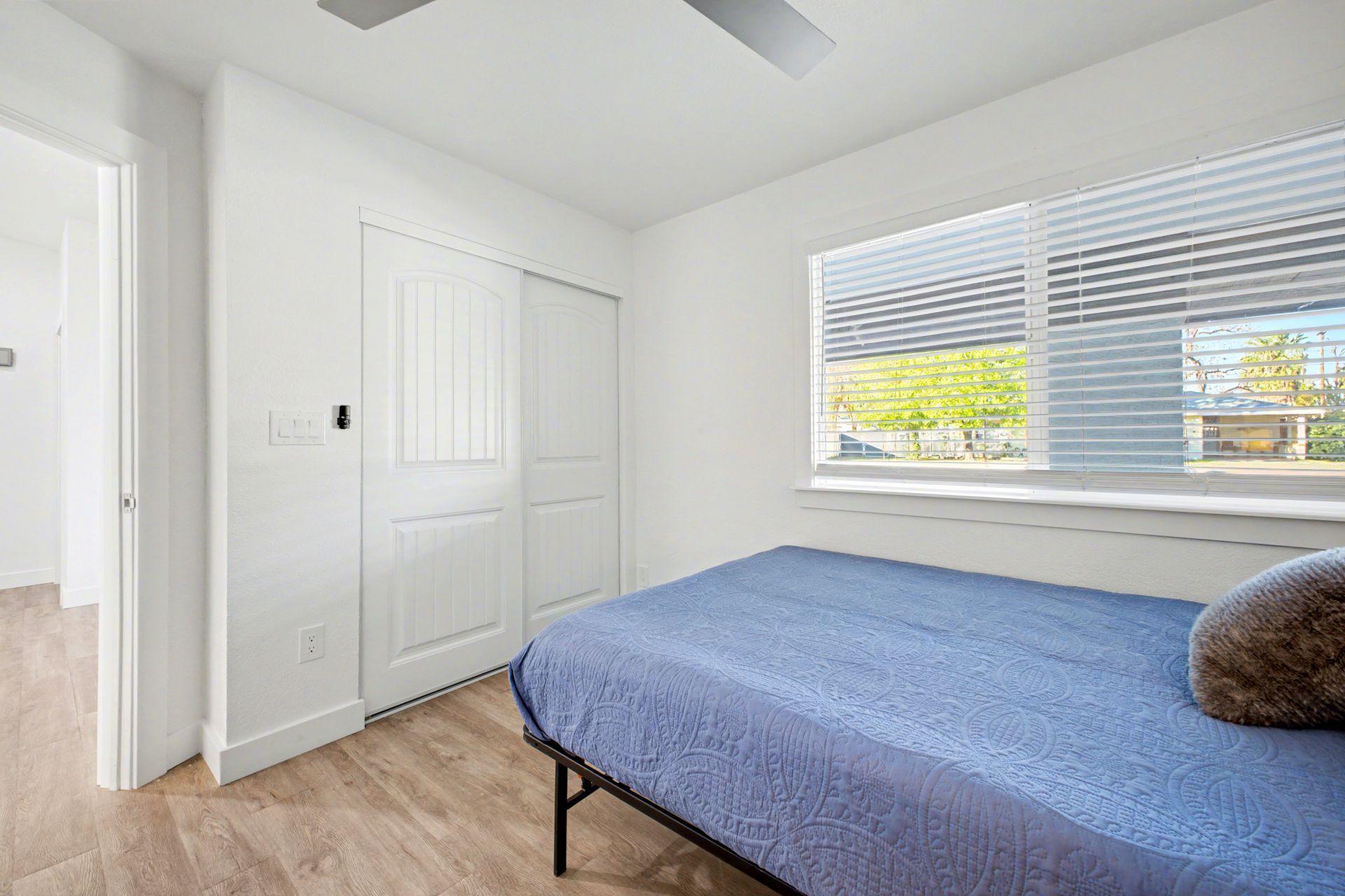Queen Size Bed
With full size closet, ceiling fan.  Window faces the front of the house.