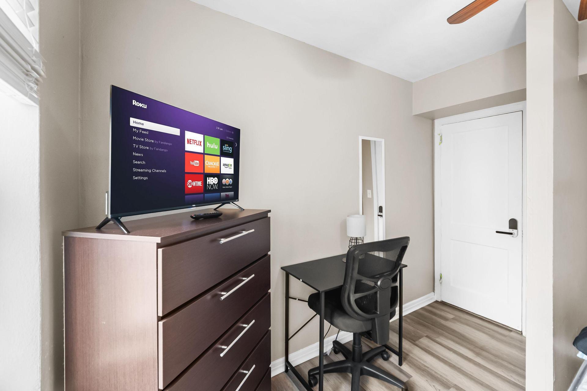 Queen bed with large closet, desk & TV