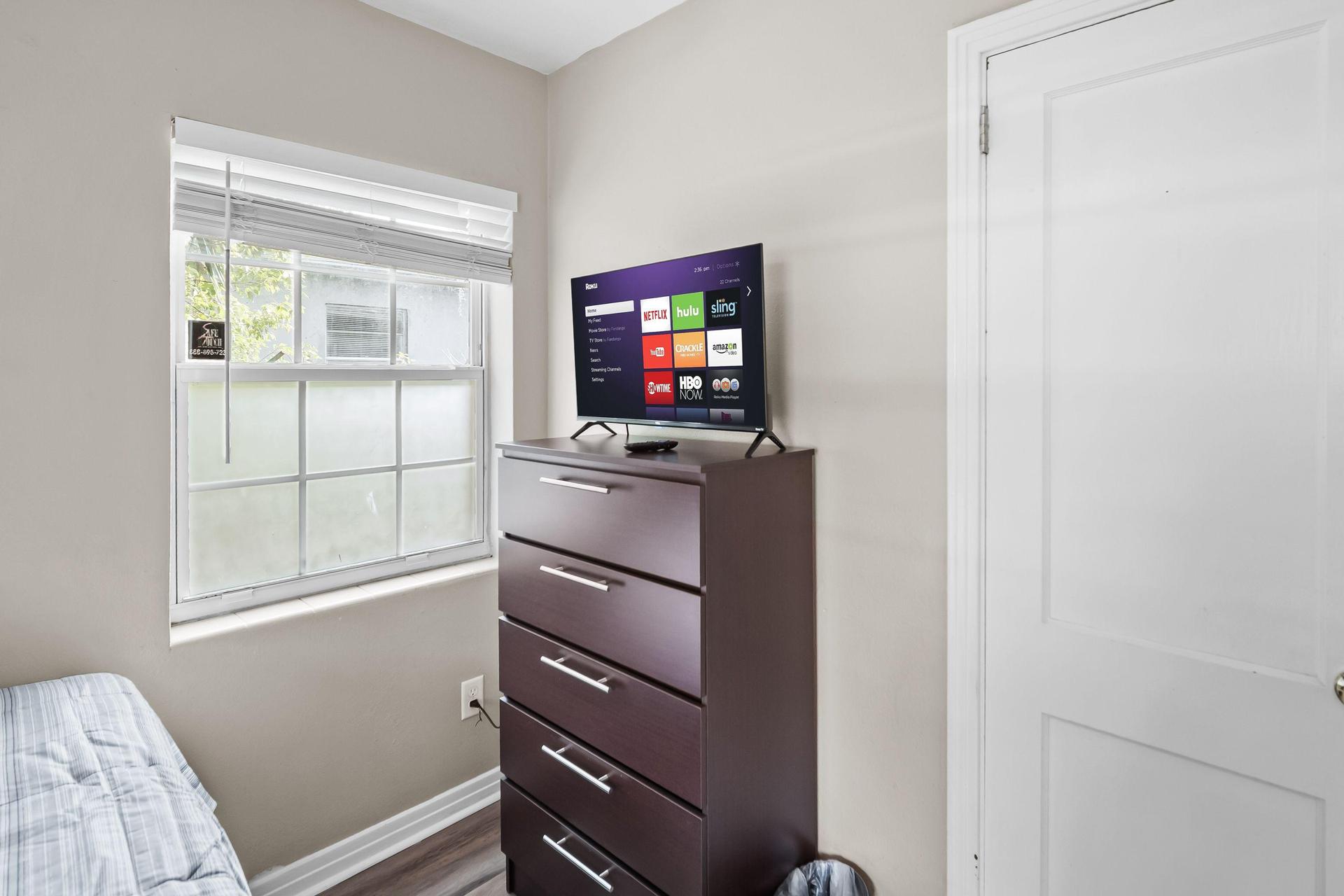 Full bed with large closet, desk & TV