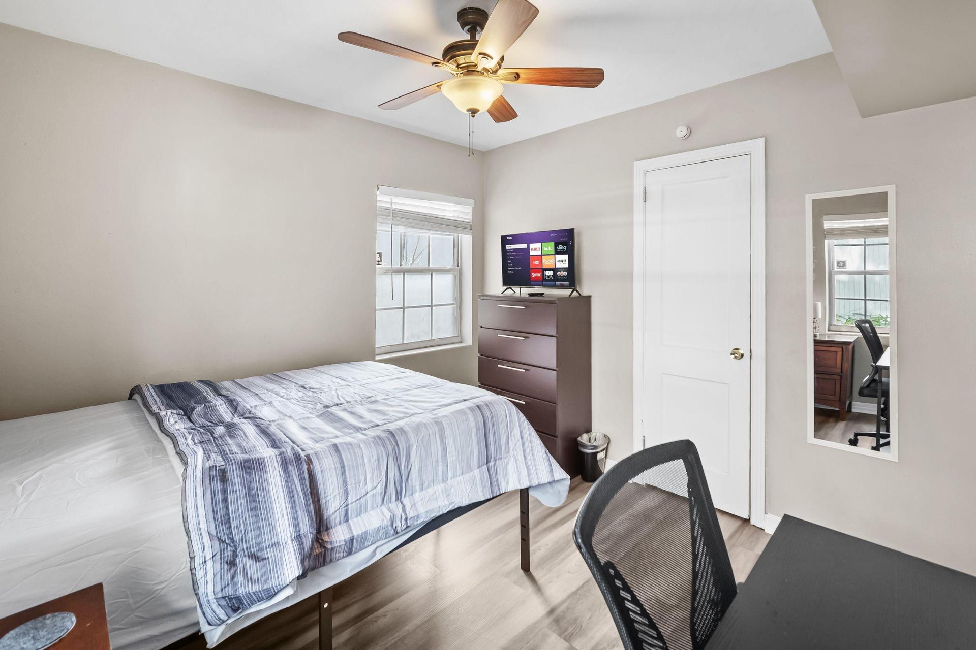 Full bed with large closet, desk & TV