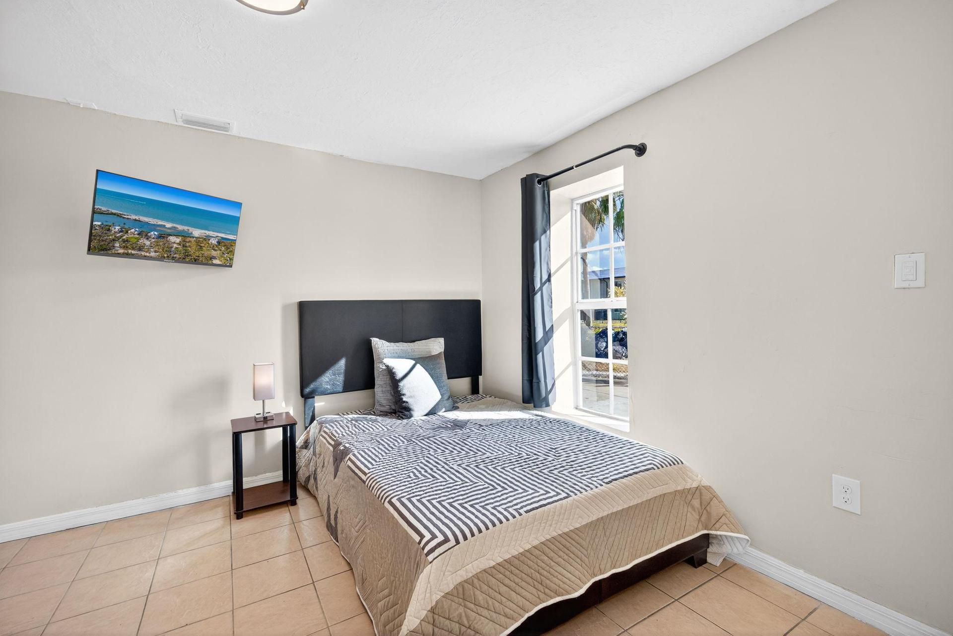 Bedroom 1 Featuring a Full-Size Bed and Lots of Natural Light