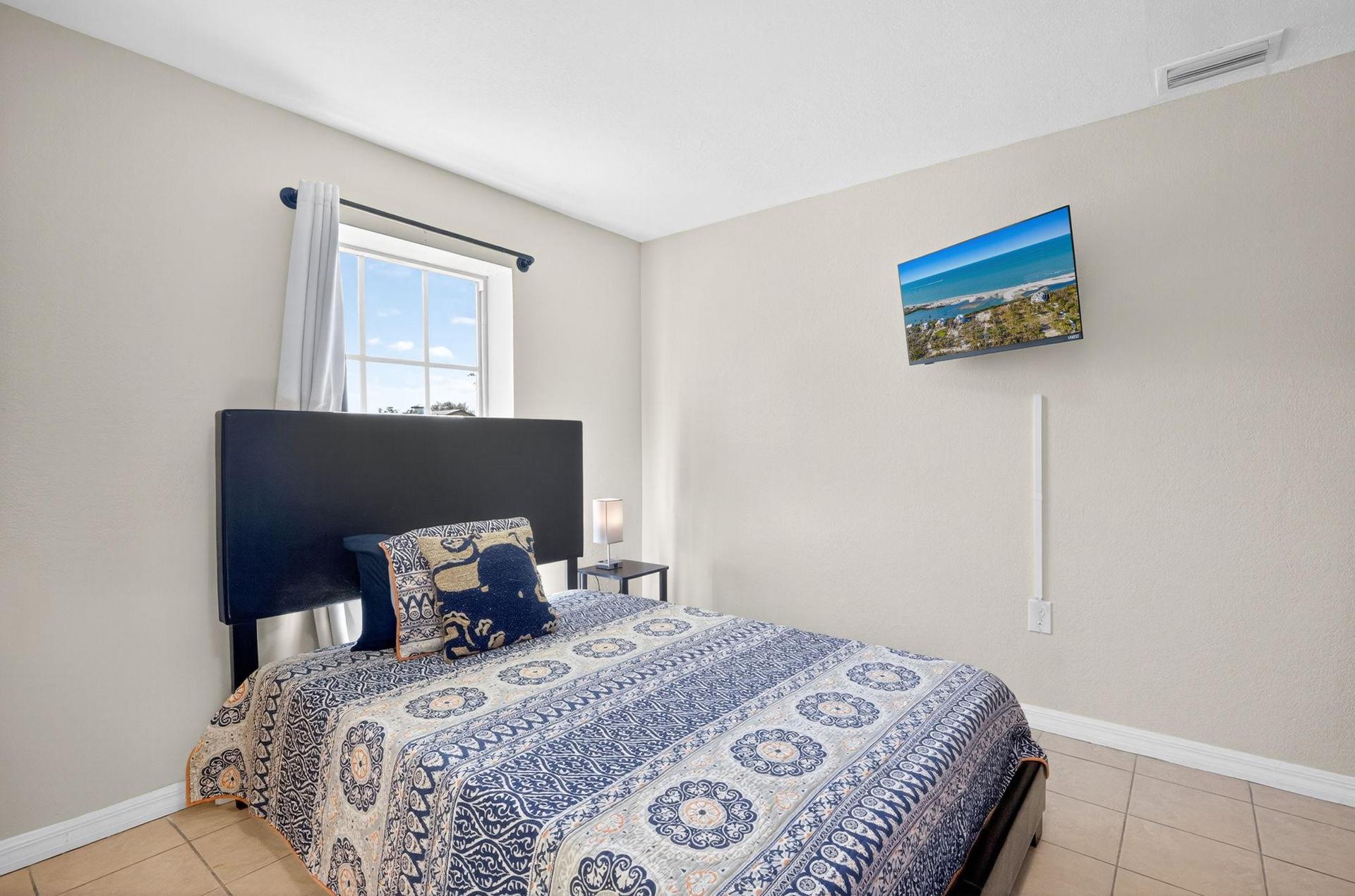 Bedroom 2 Featuring a Full-Size Bed and Lots of Natural Light